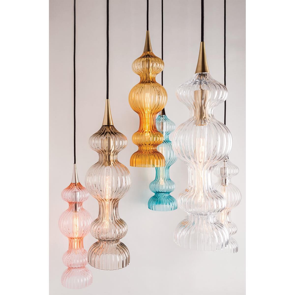 Shown in Aged Brass finish and Clear glass