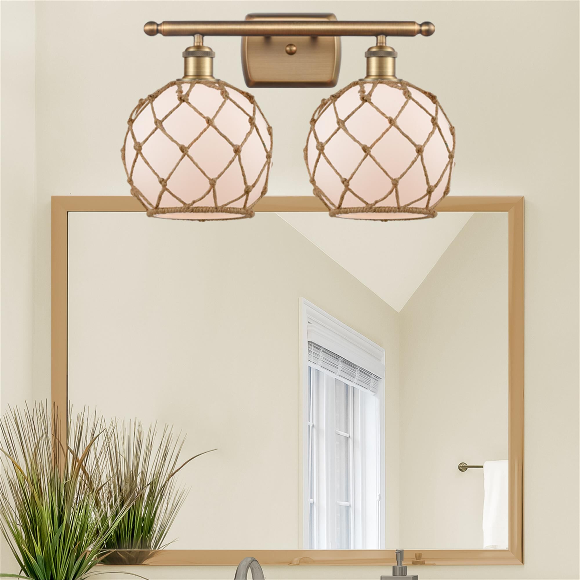 Shown in Brushed Brass finish and White glass and Brown Rope accent