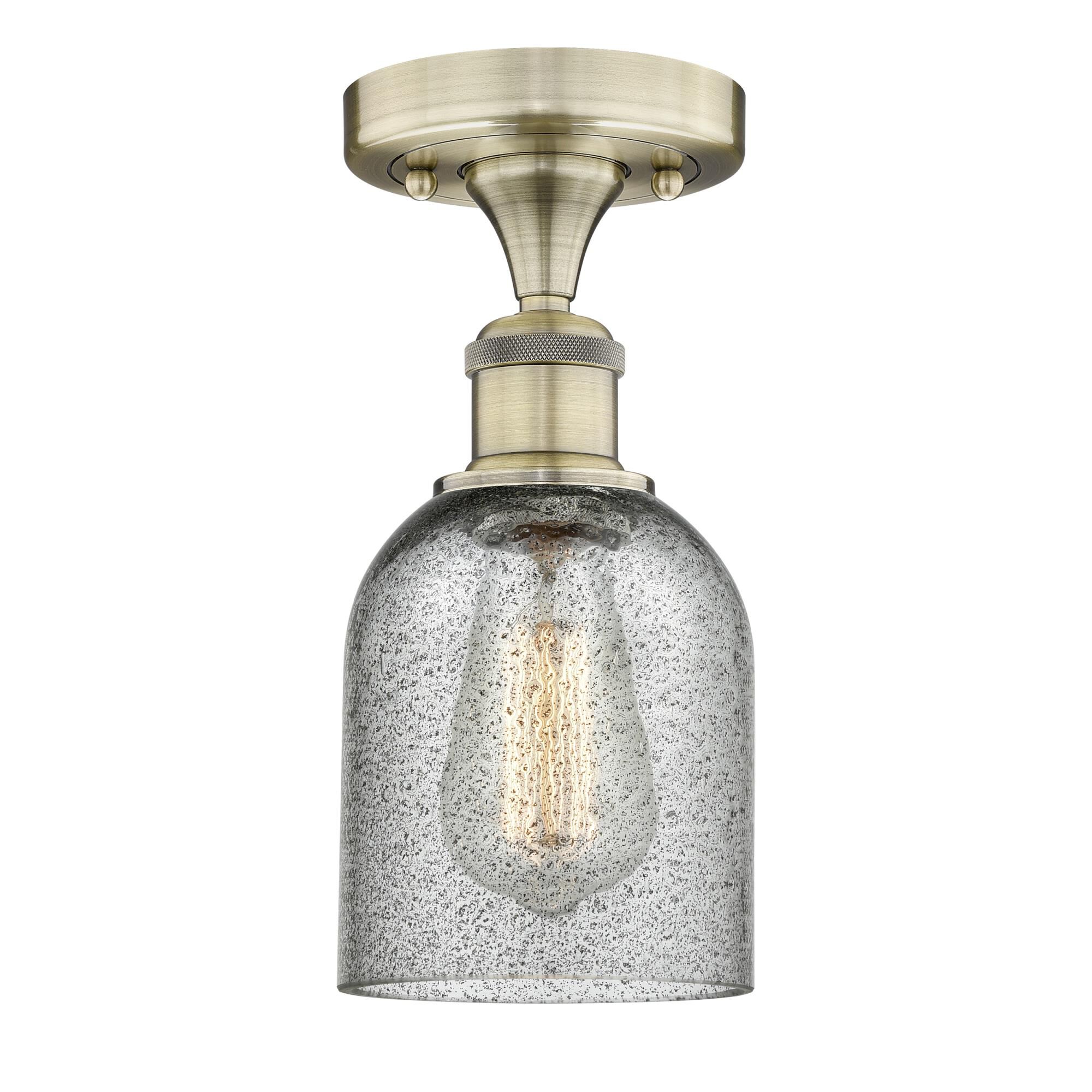 Shown in Antique Brass finish and Charcoal glass