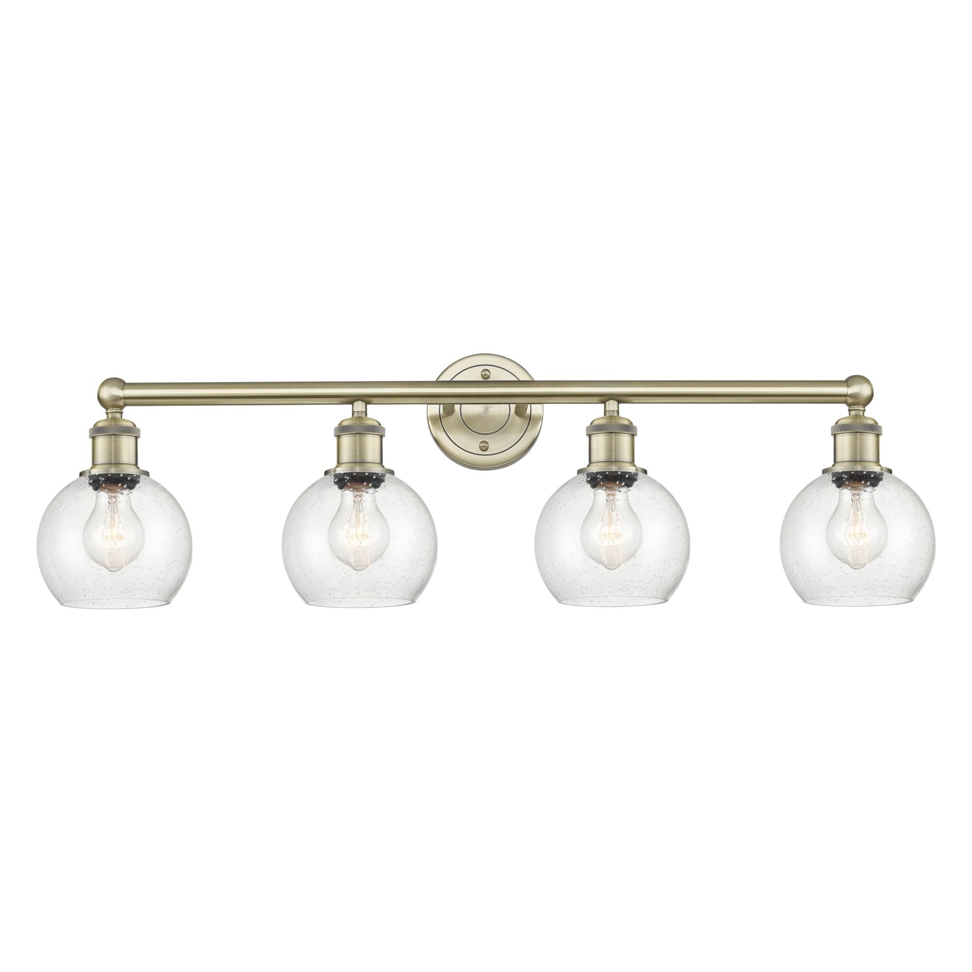 Shown in Antique Brass finish and Seedy glass