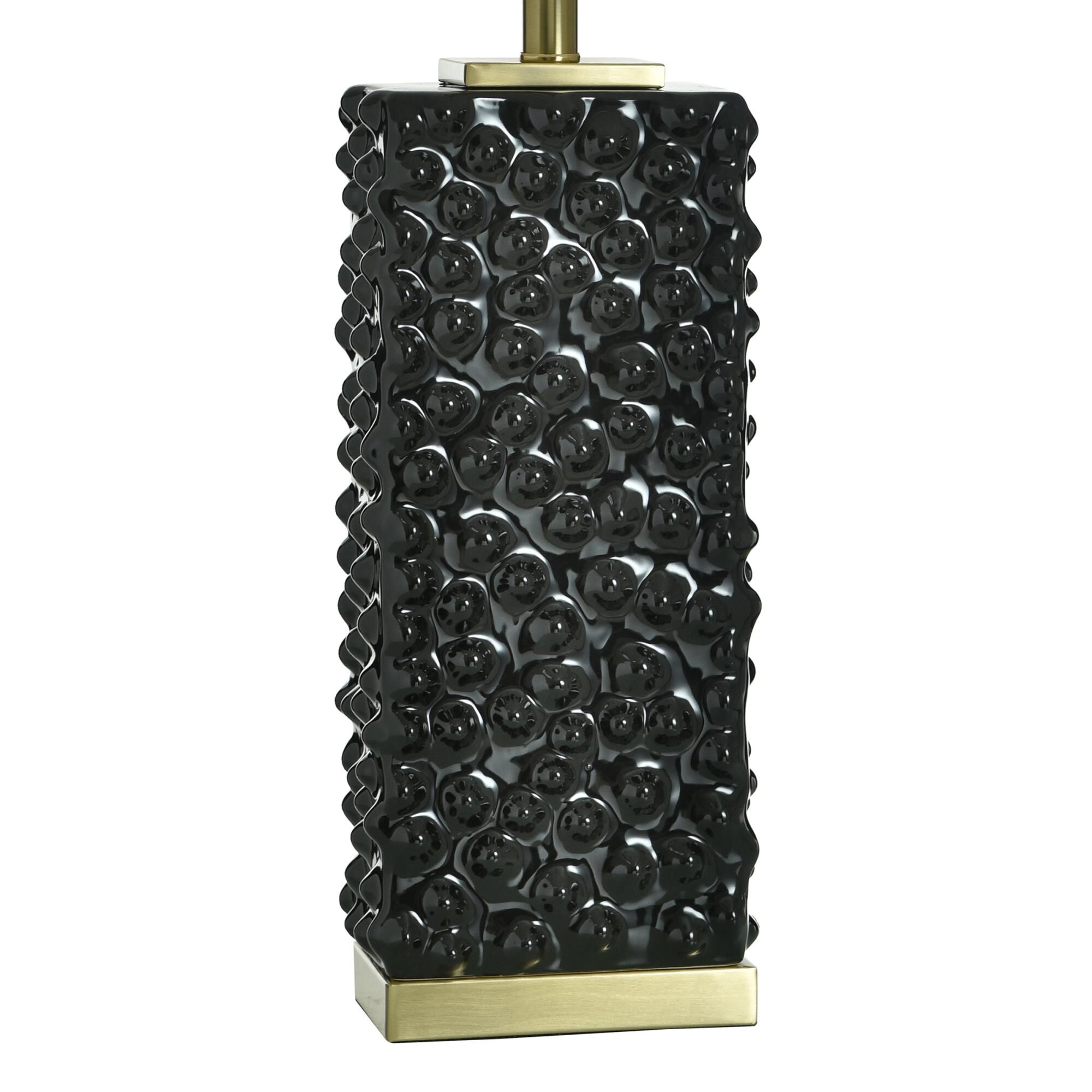 Shown in Polished Brass and Glossy Black finish and Off-White shade