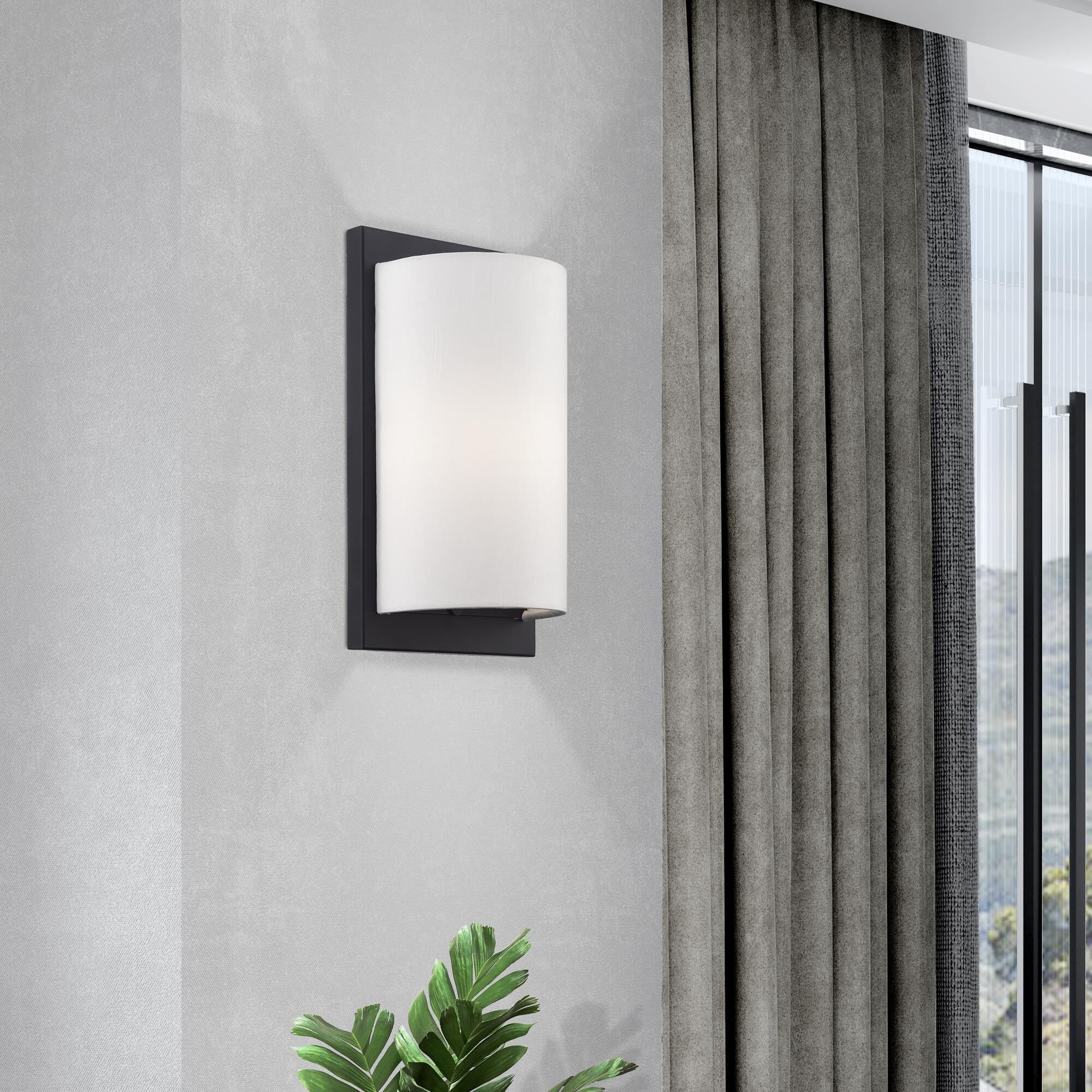 Shown in Black finish and Hand Crafted Off-White Fabric Hardback shade