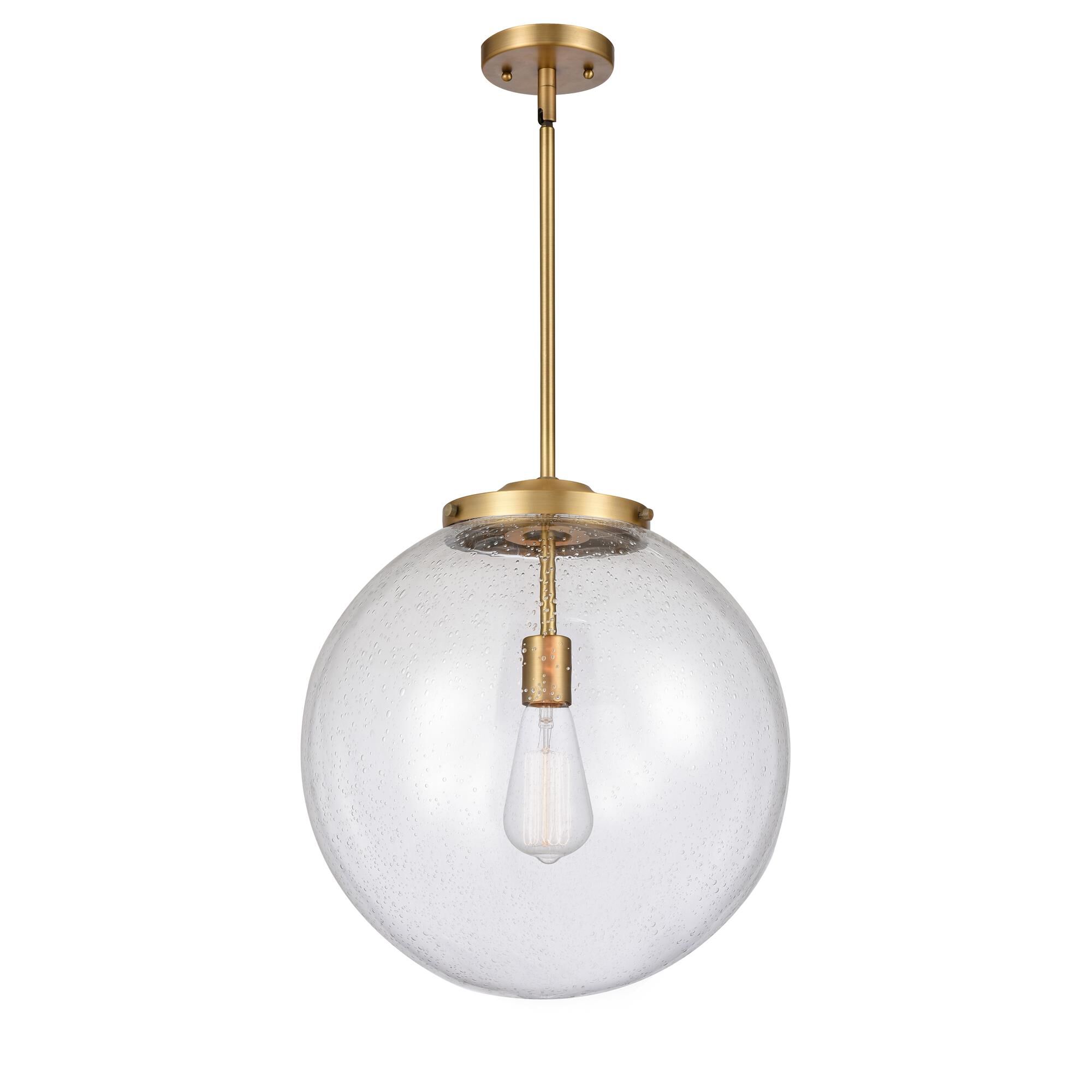 Shown in Brushed Brass finish and Seedy Beacon glass