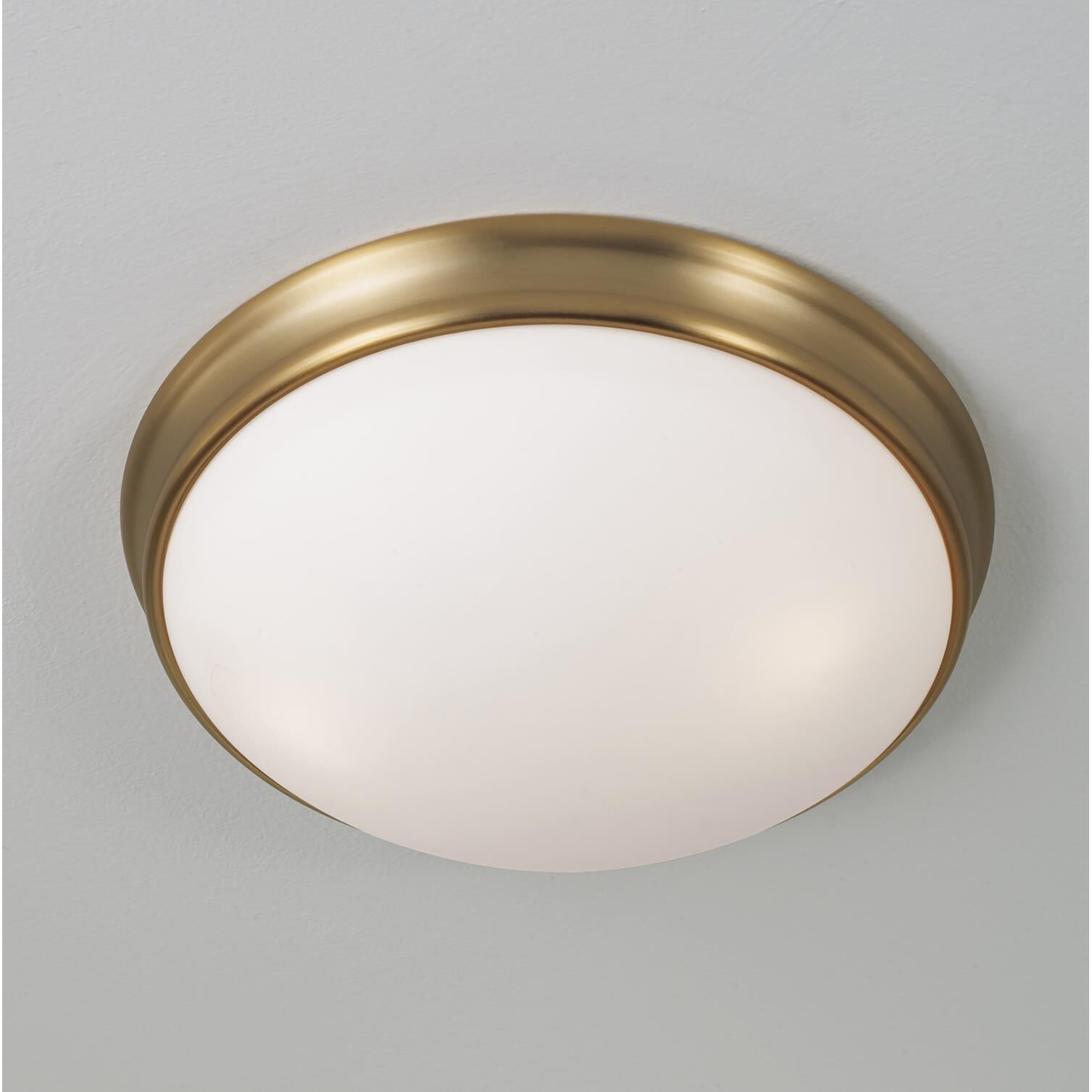 Shown in Aged Brass finish and Soft White glass