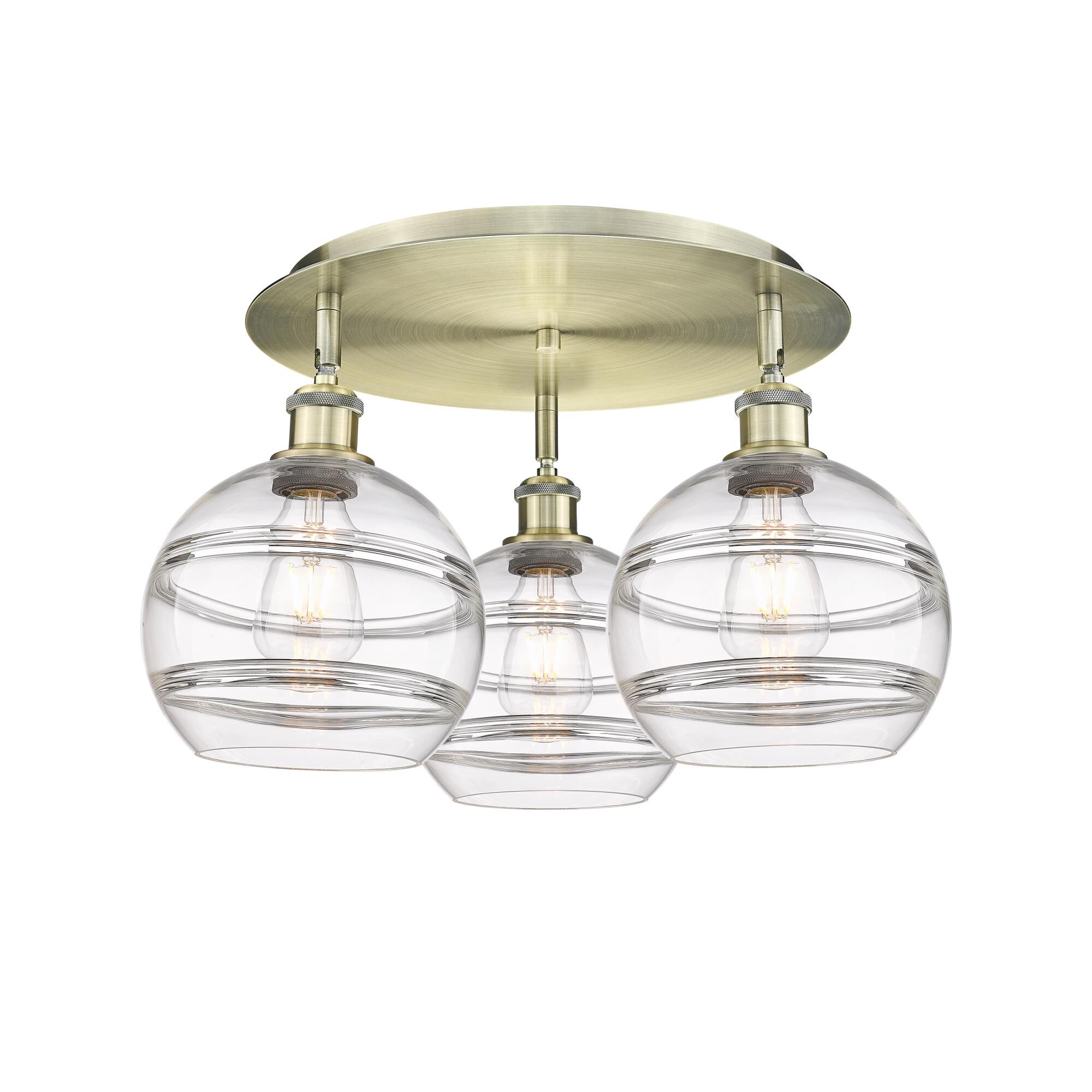 Shown in Antique Brass finish and Clear glass