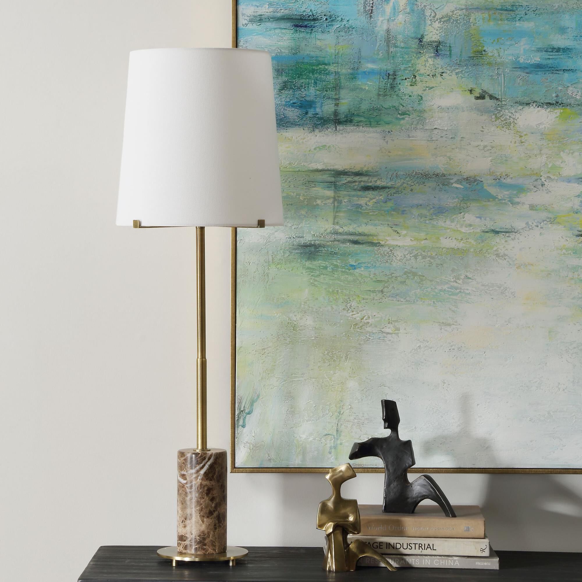 Shown in The Sepia Buffet Lamp Showcases A Brown Marble Cylinder Base Accented With Plated Antique Brass Deta finish and Round Hardback  Rolled Edge shade
