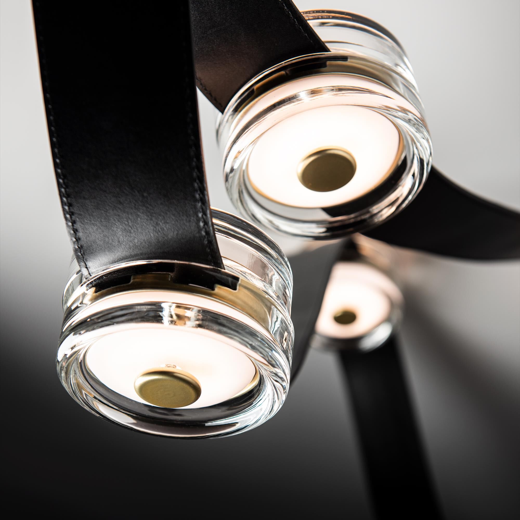 Shown in Modern Brass finish and Alabaster glass and Black Leather accent