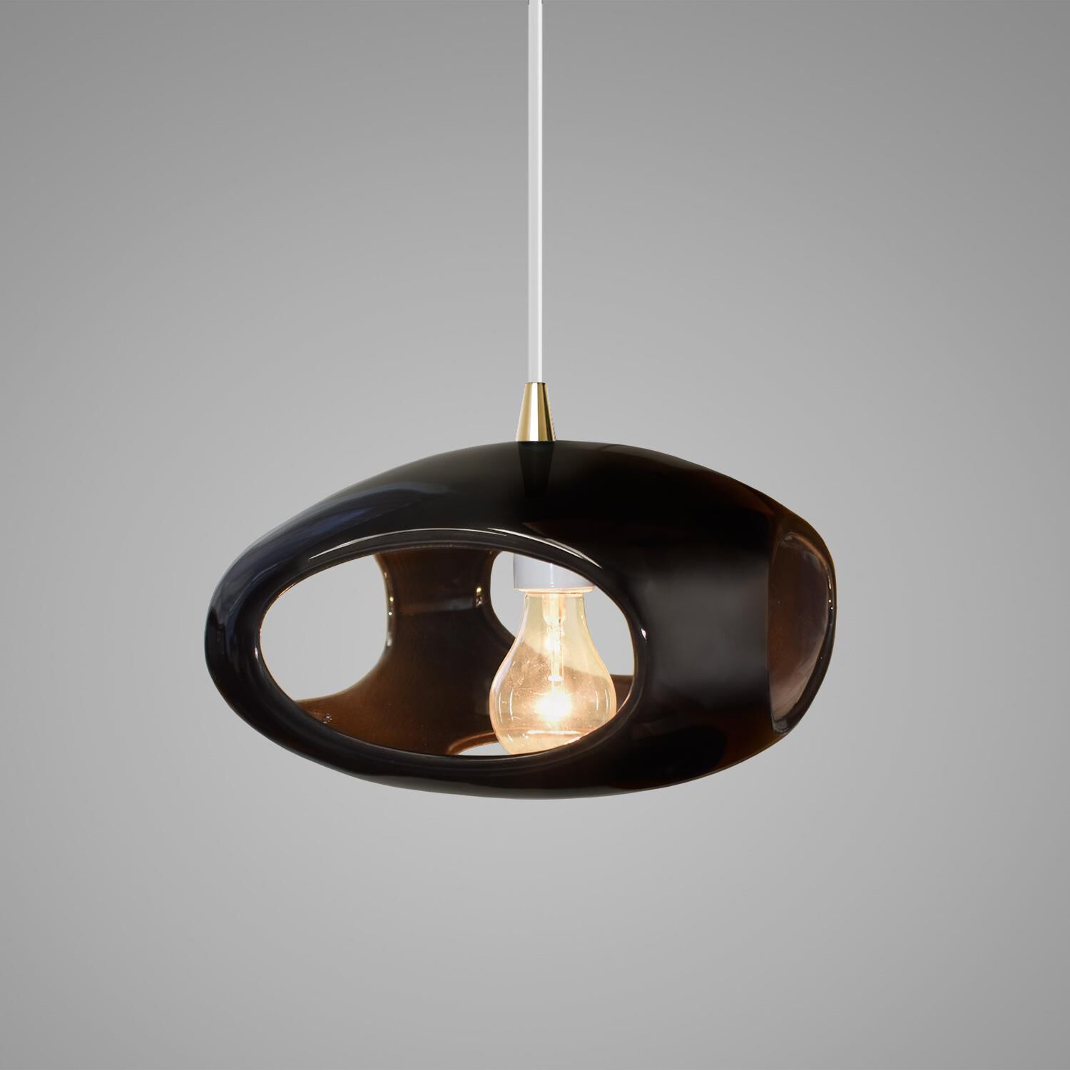 Shown in Antique Brass finish and Gloss Black Ceramic shade