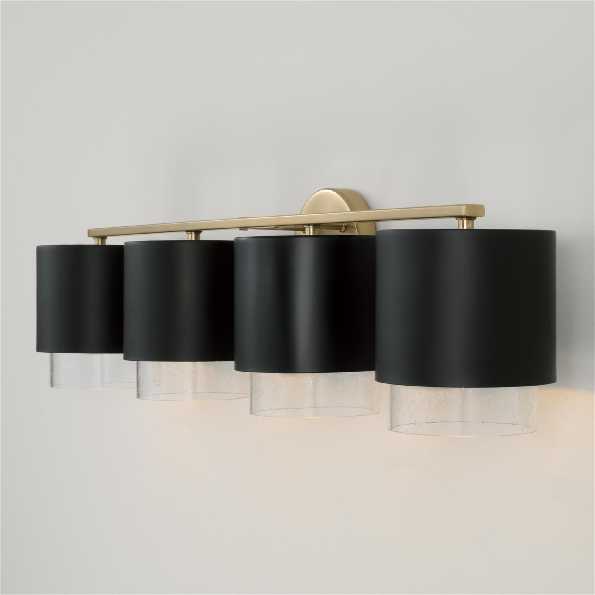Shown in Matte Brass and Black finish and Clear Seeded glass and Metal with Brass Interior shade