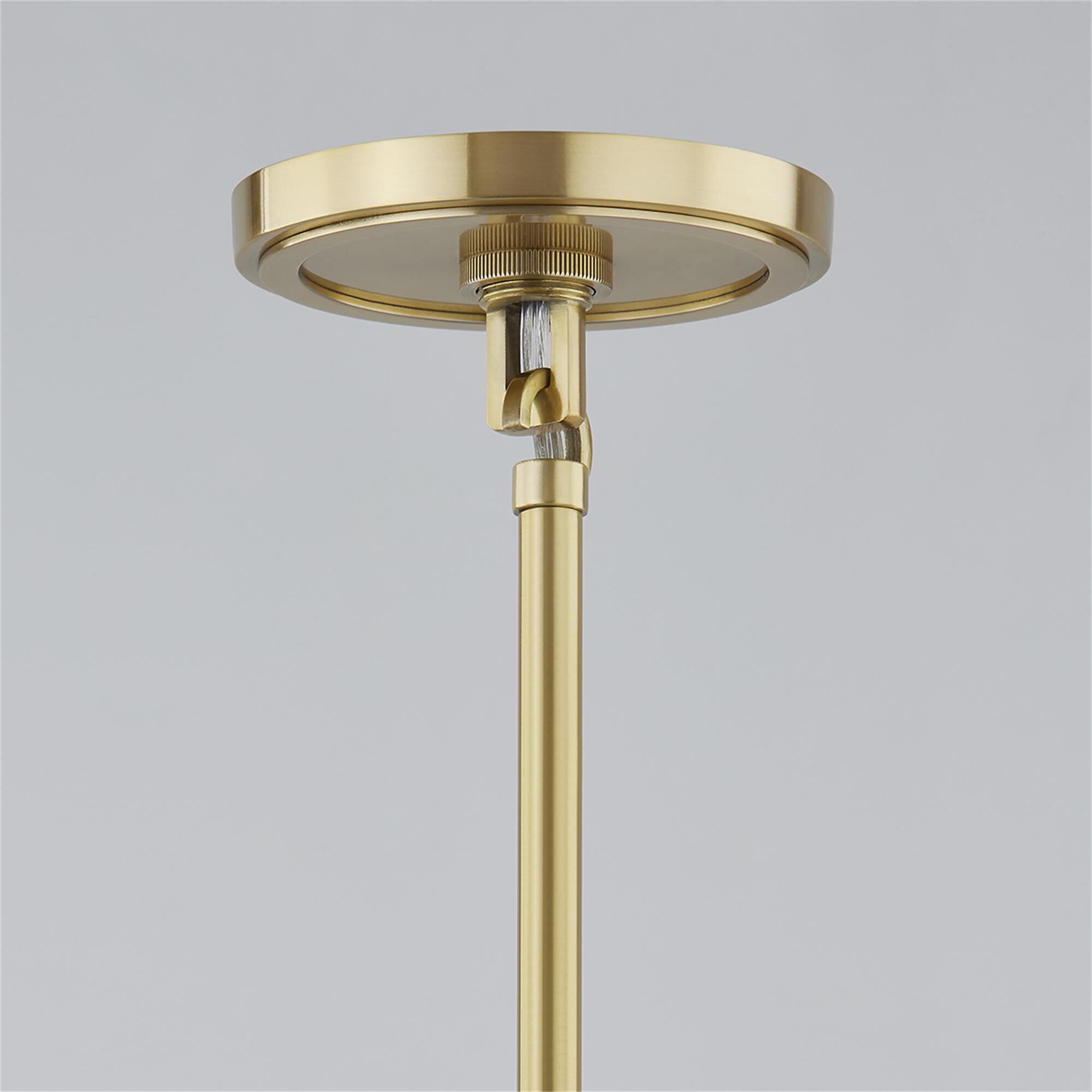 Shown in Aged Brass and Glossy White finish and Metal shade