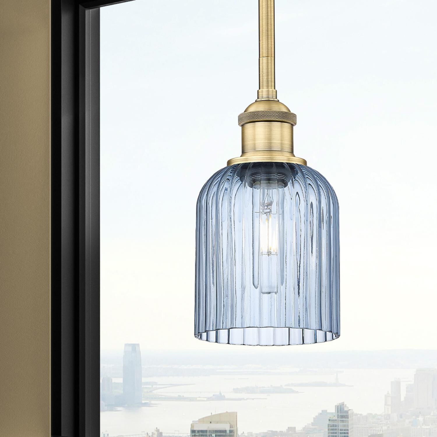 Shown in Brushed Brass finish and Princess Blue glass