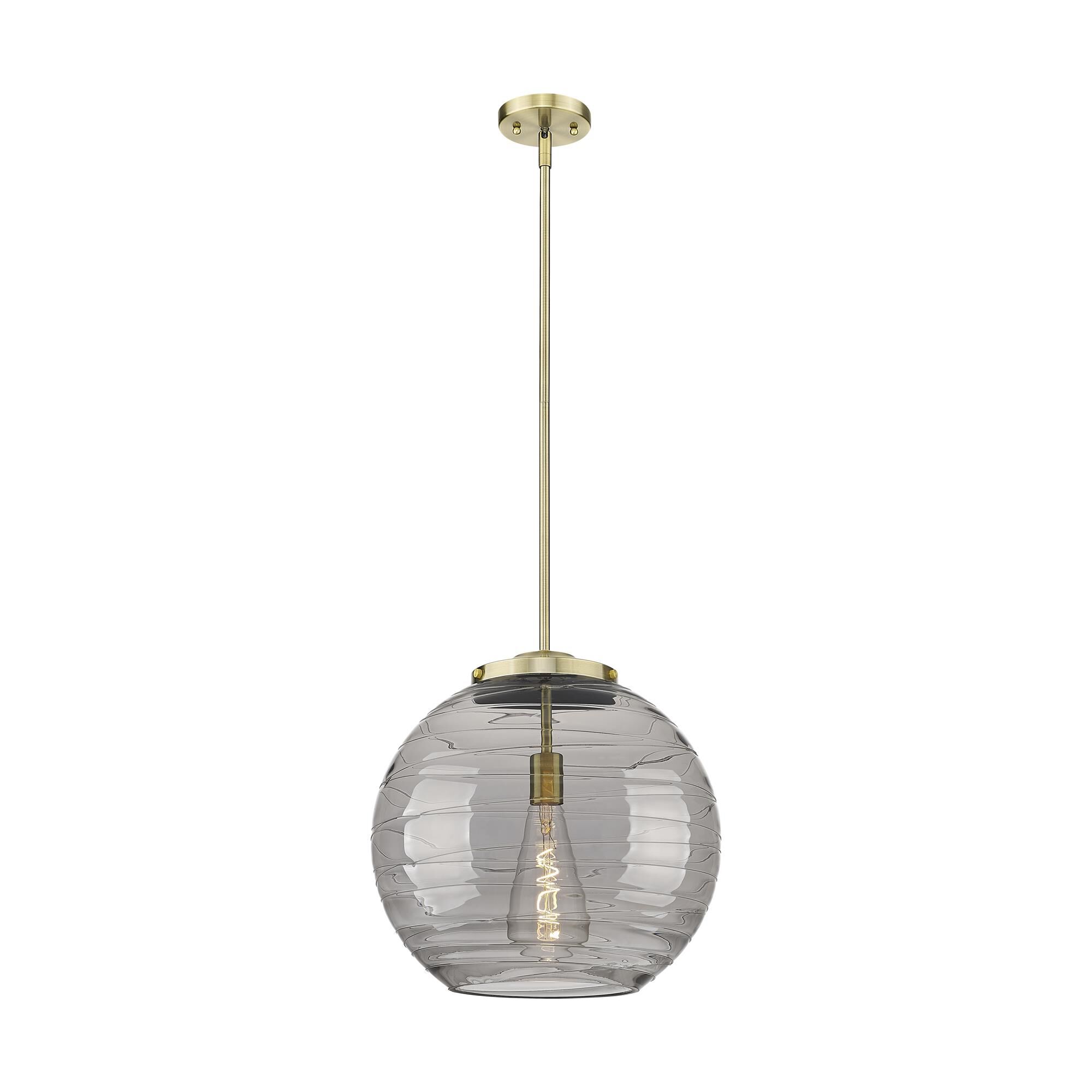 Shown in Antique Brass finish and Light Smoke Deco Swirl glass