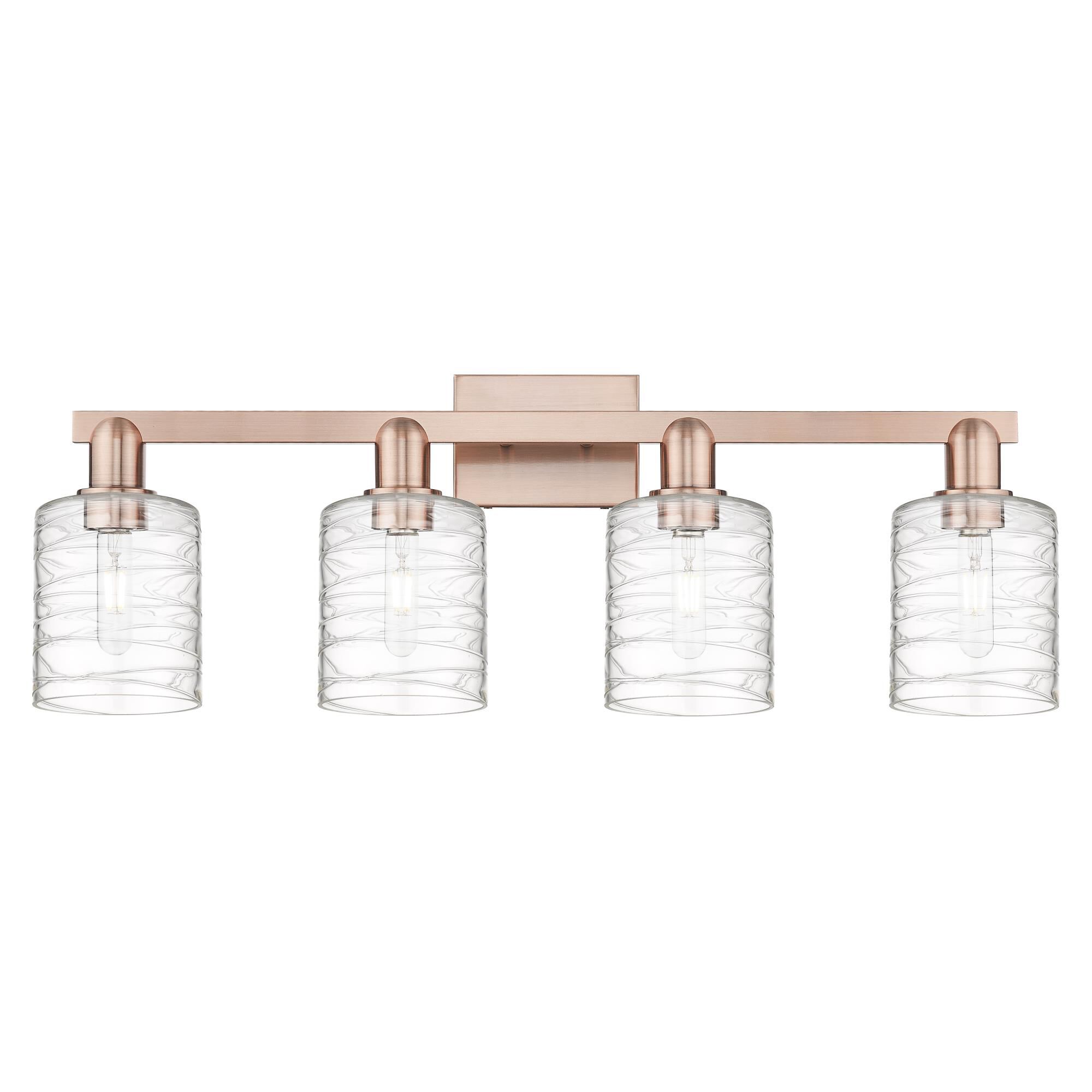 Shown in Antique Copper finish and Deco Swirl glass