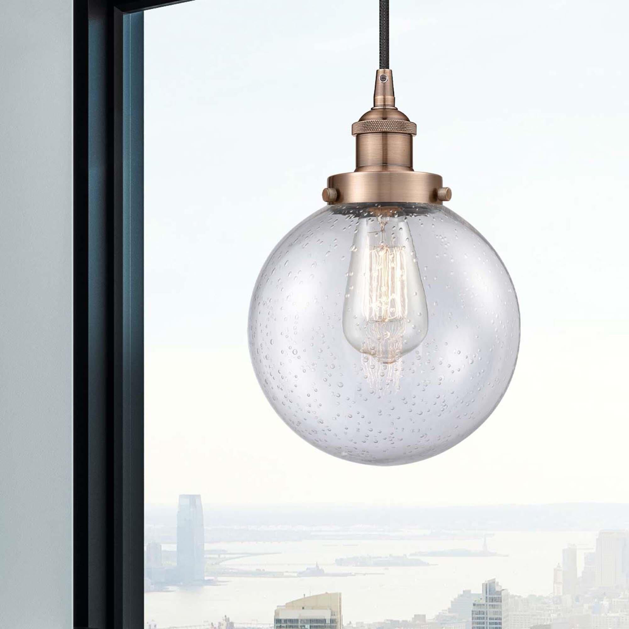 Shown in Antique Copper finish and Seedy Beacon glass