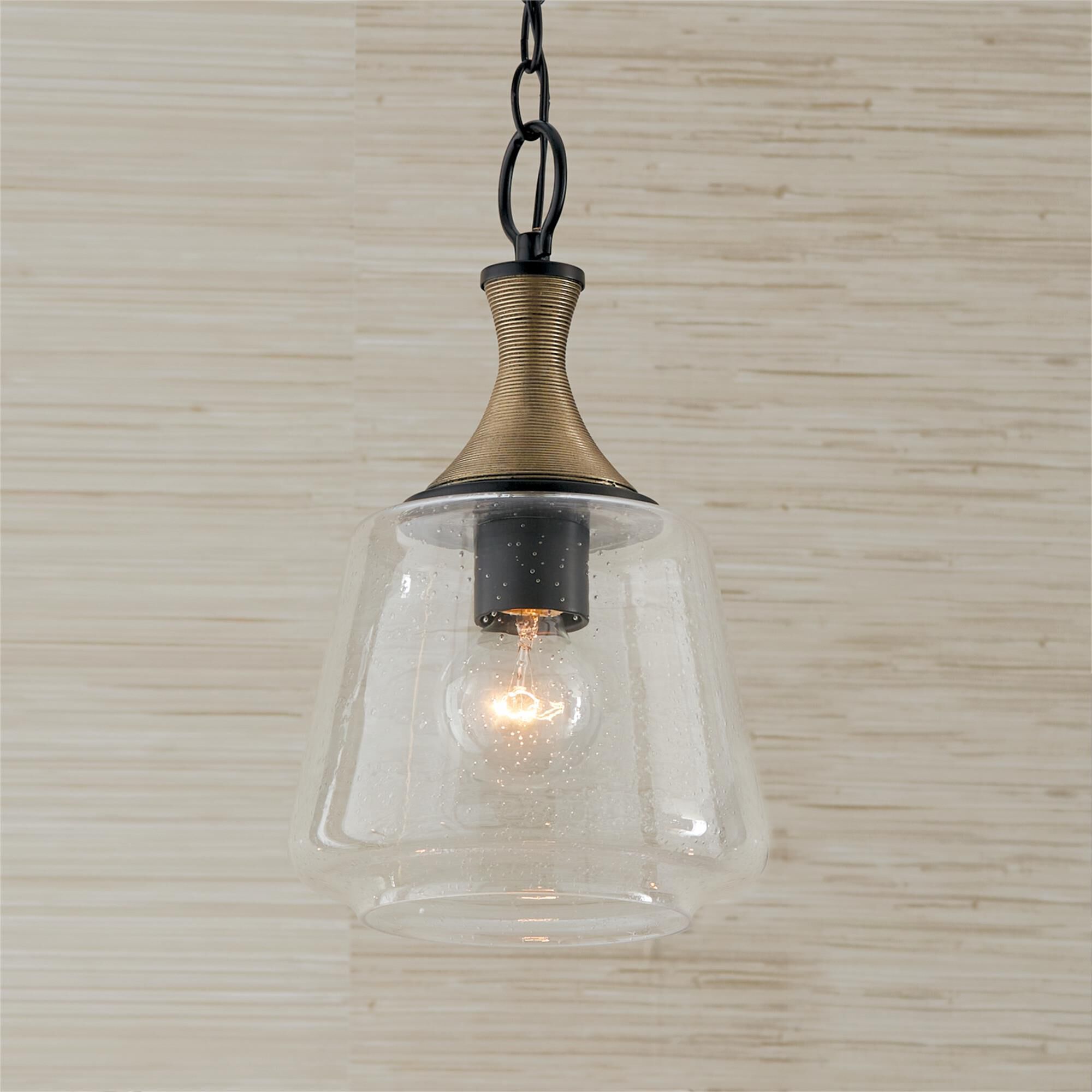 Shown in Matte Black With Brass finish and Clear Seeded glass
