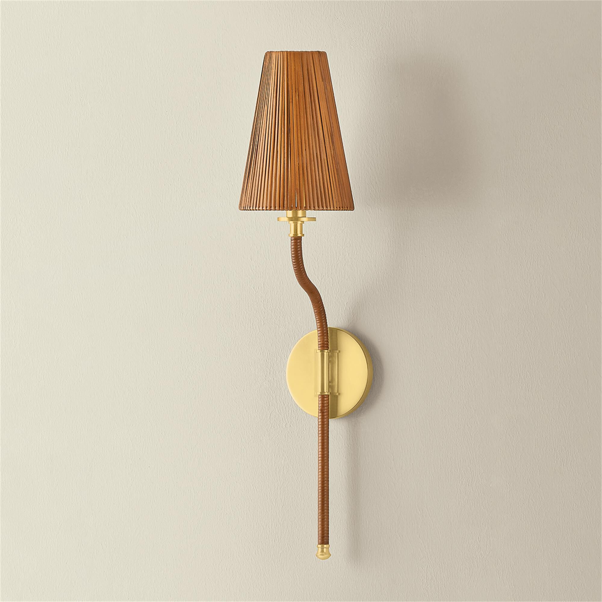 Shown in Aged Brass finish and Natural Woven Rattan shade