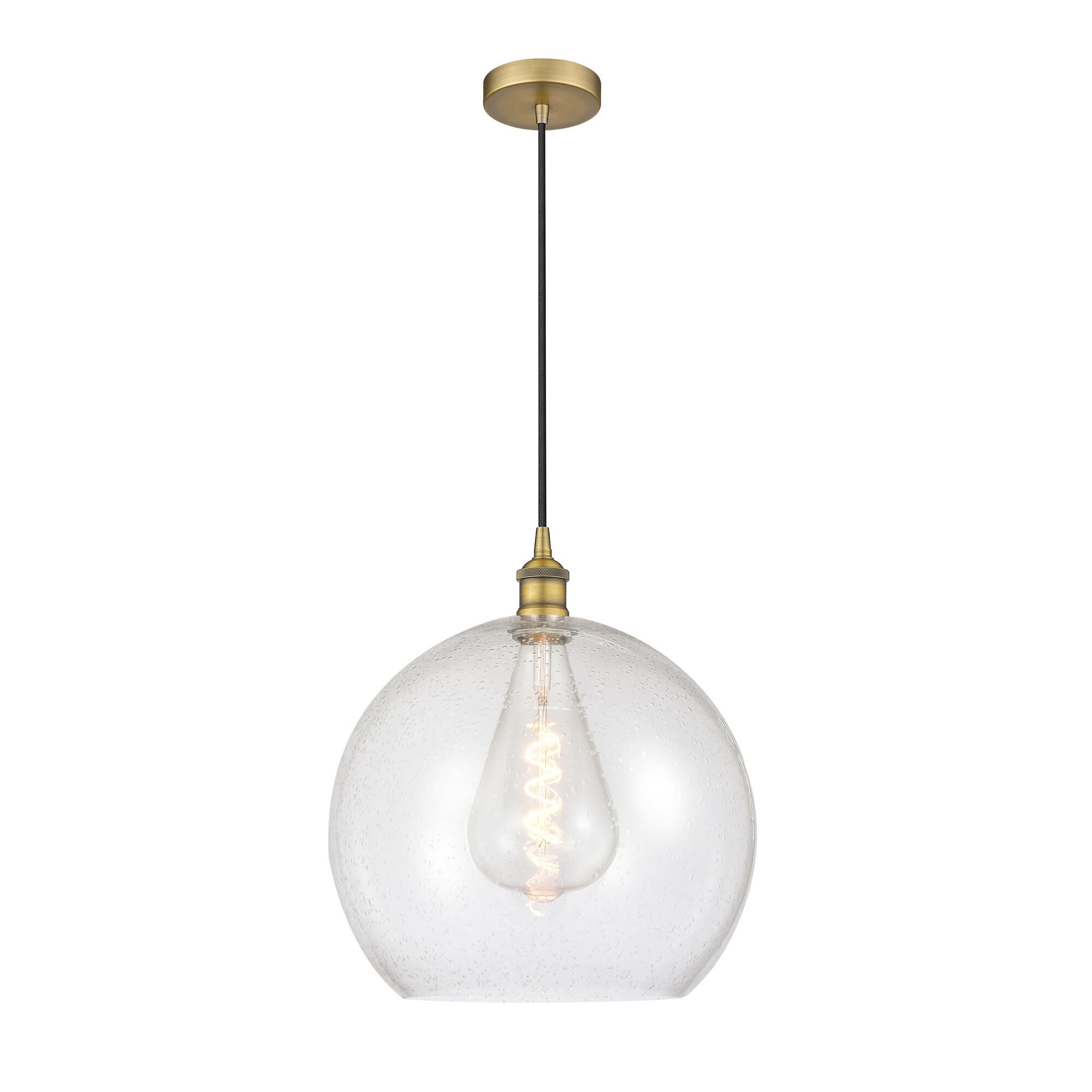 Shown in Brushed Brass finish and Seedy glass