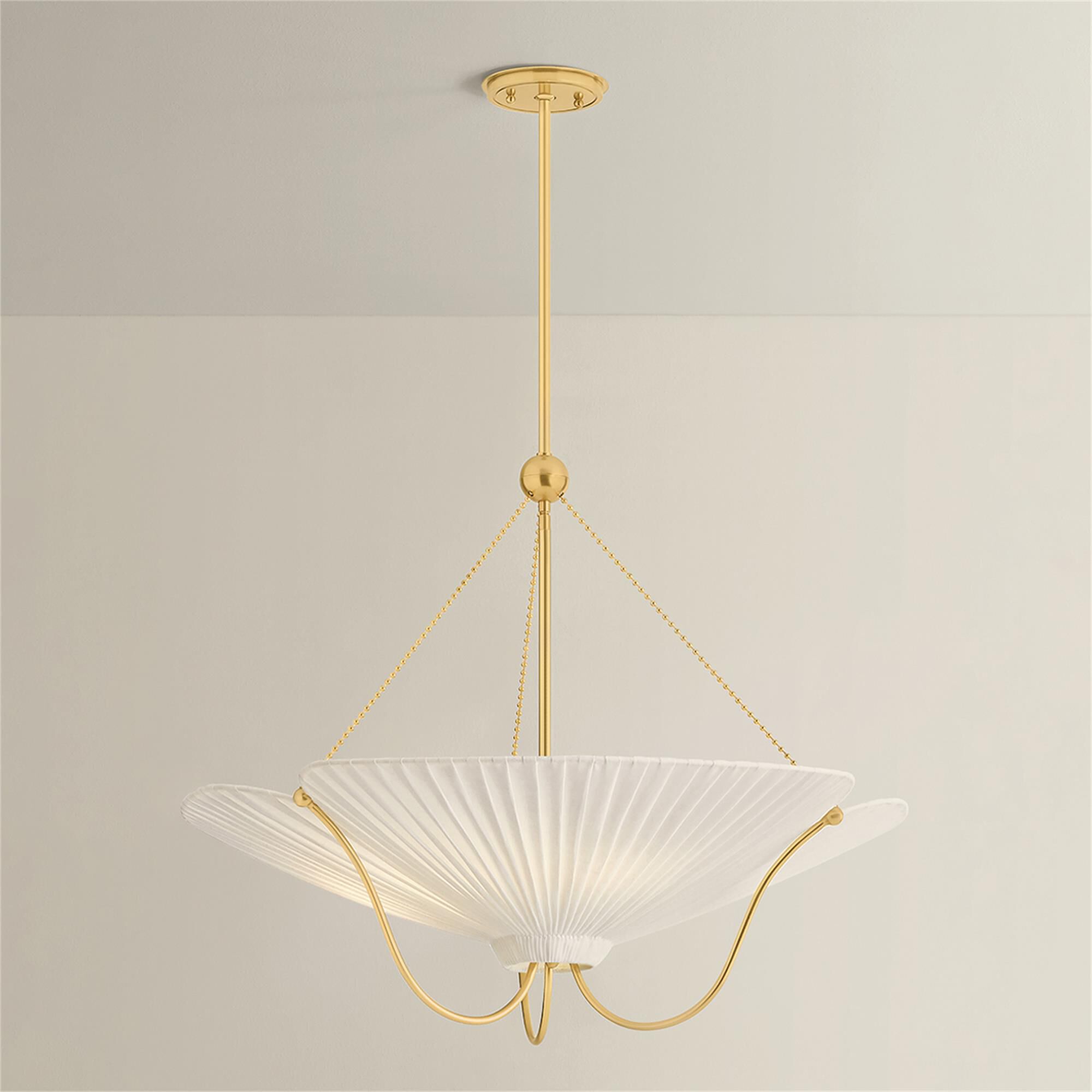 Shown in Aged Brass finish and Ivory Linen shade