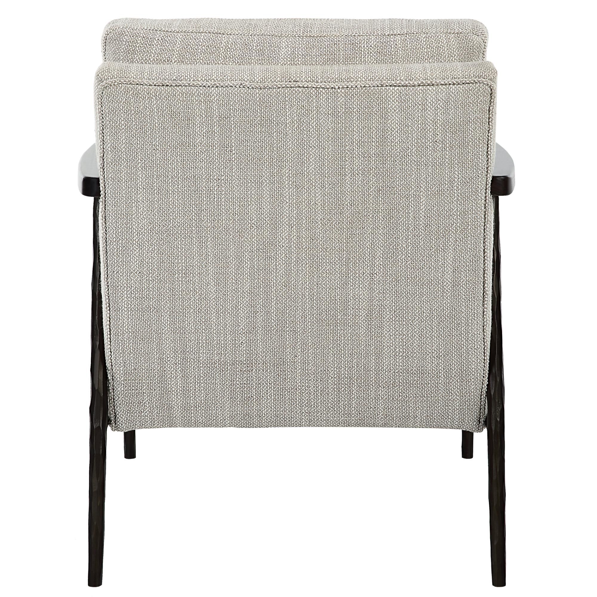 Shown in A Modern Mix Of Materials With Hints Of Masculinity, This Accent Chair Features A Textured Cast Iron finish