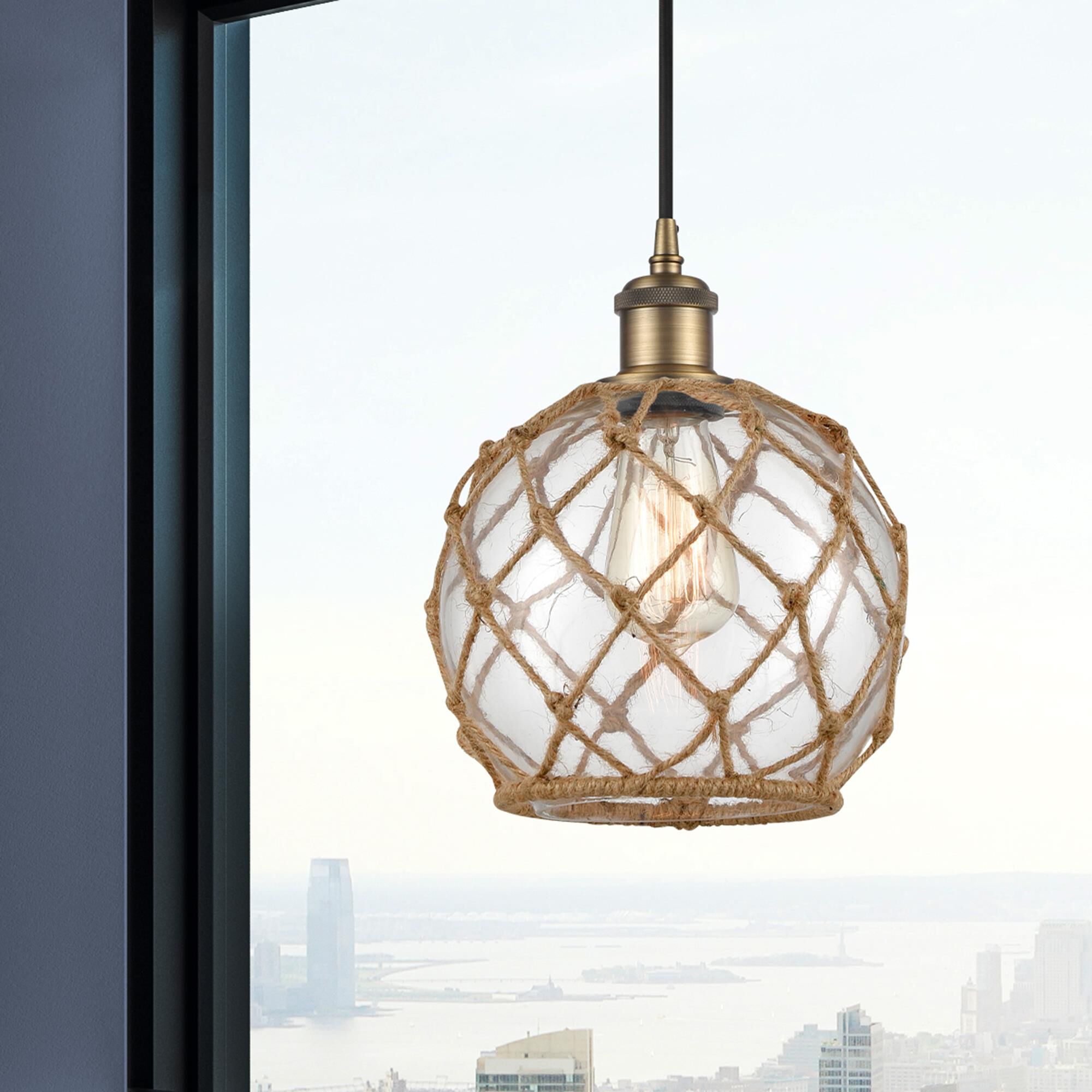 Shown in Brushed Brass finish and Clear Farmhousewith Brown Rope glass and Polished Chrome accent