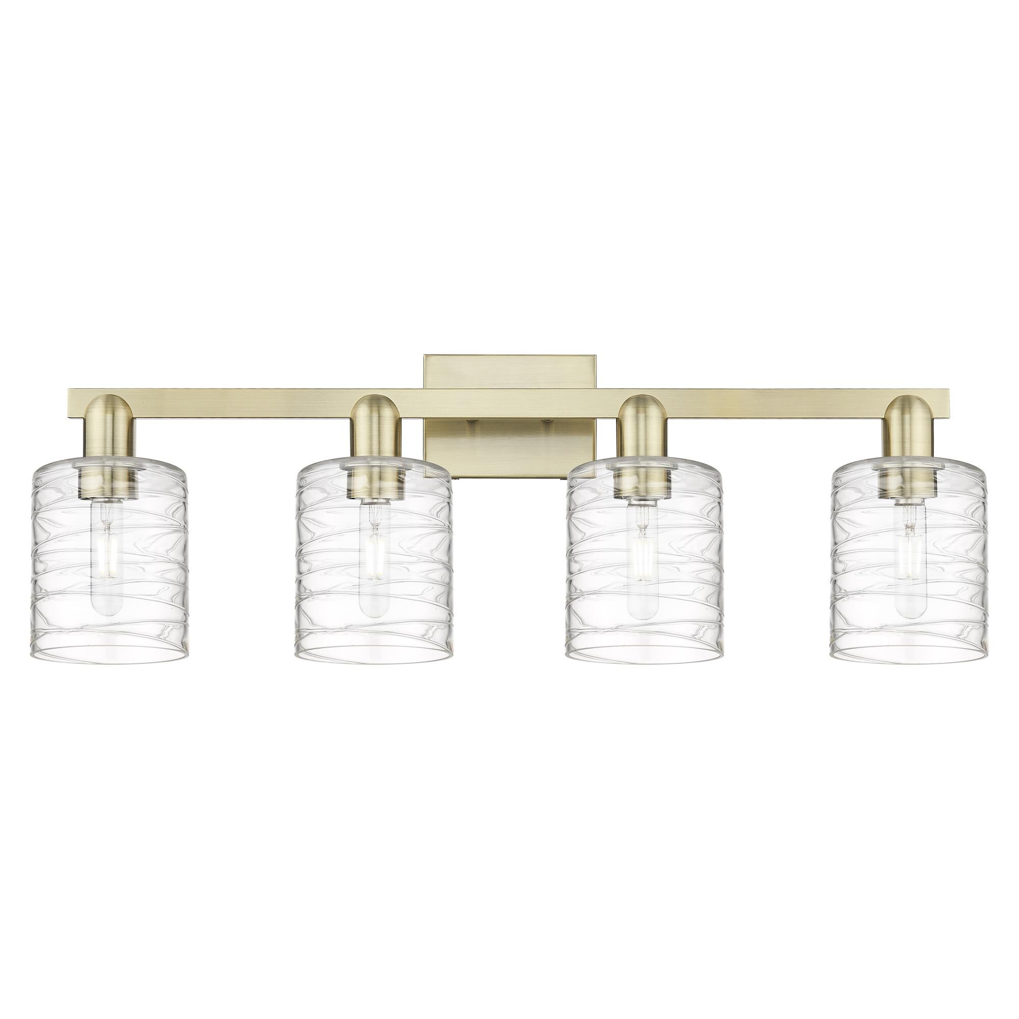 Shown in Antique Brass finish and Deco Swirl glass