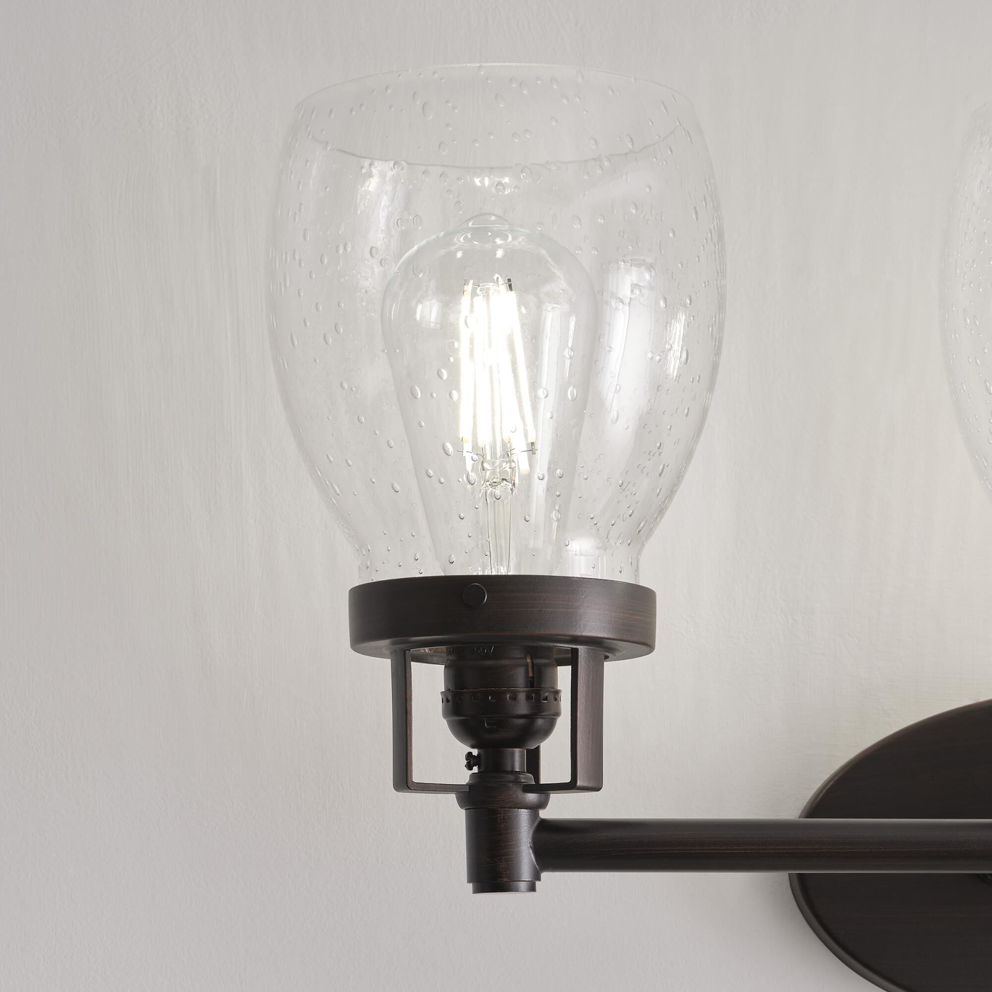 Shown in Bronze finish and Clear Seeded glass