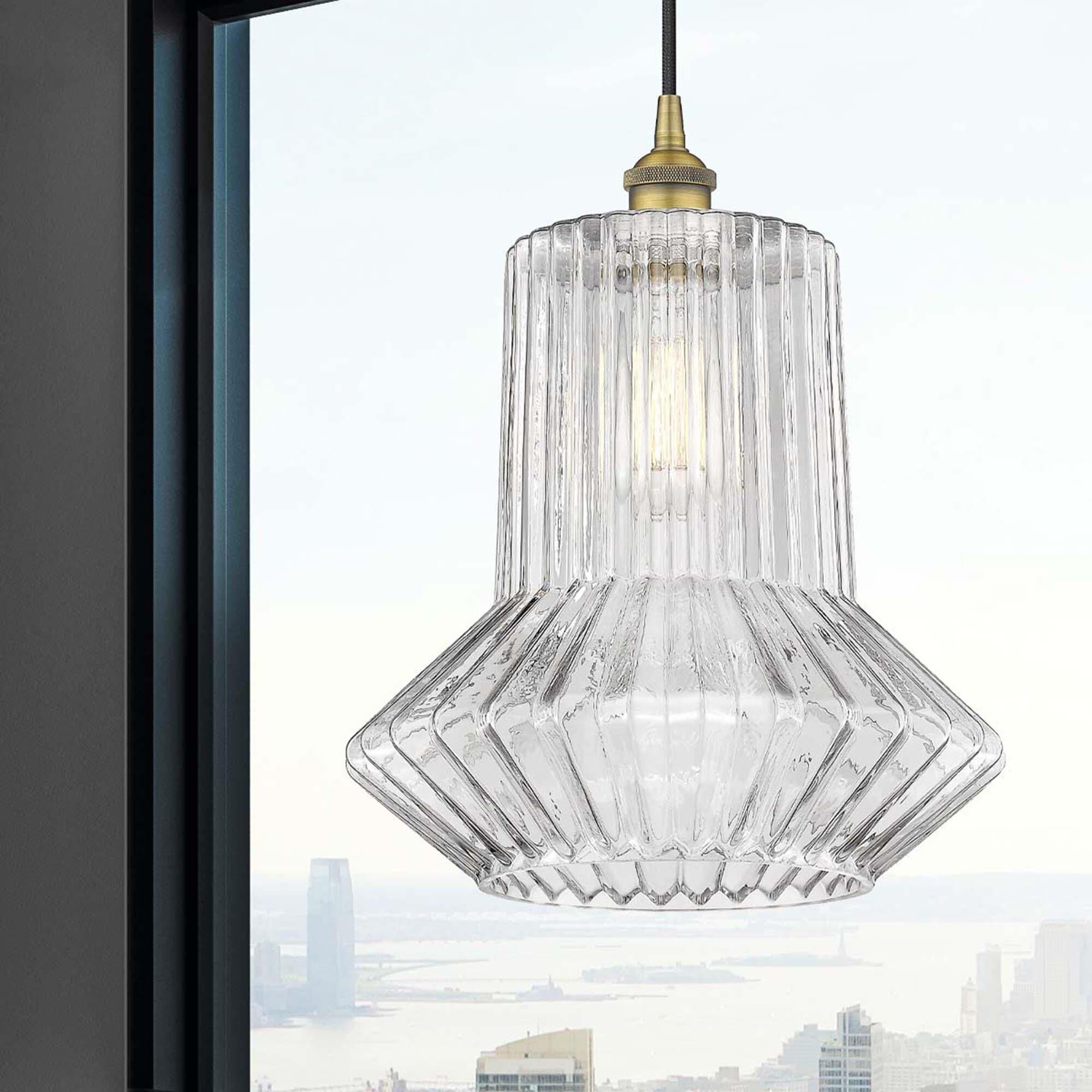 Shown in Brushed Brass finish and Clear Spiral Fluted Springwater glass