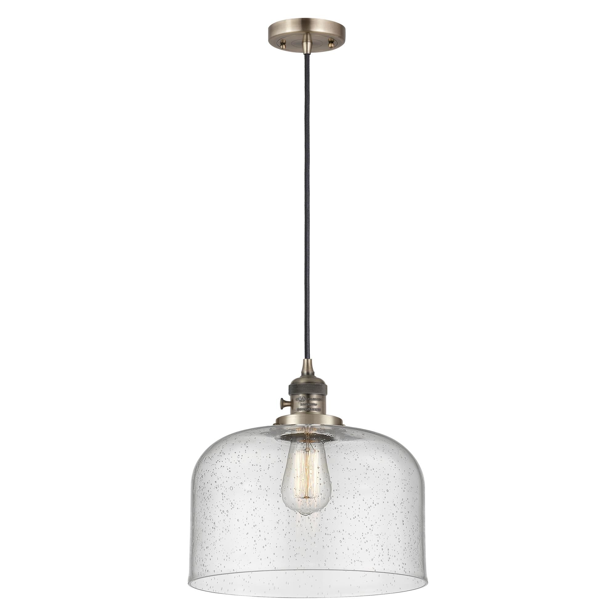Shown in Antique Brass finish and Seedy glass