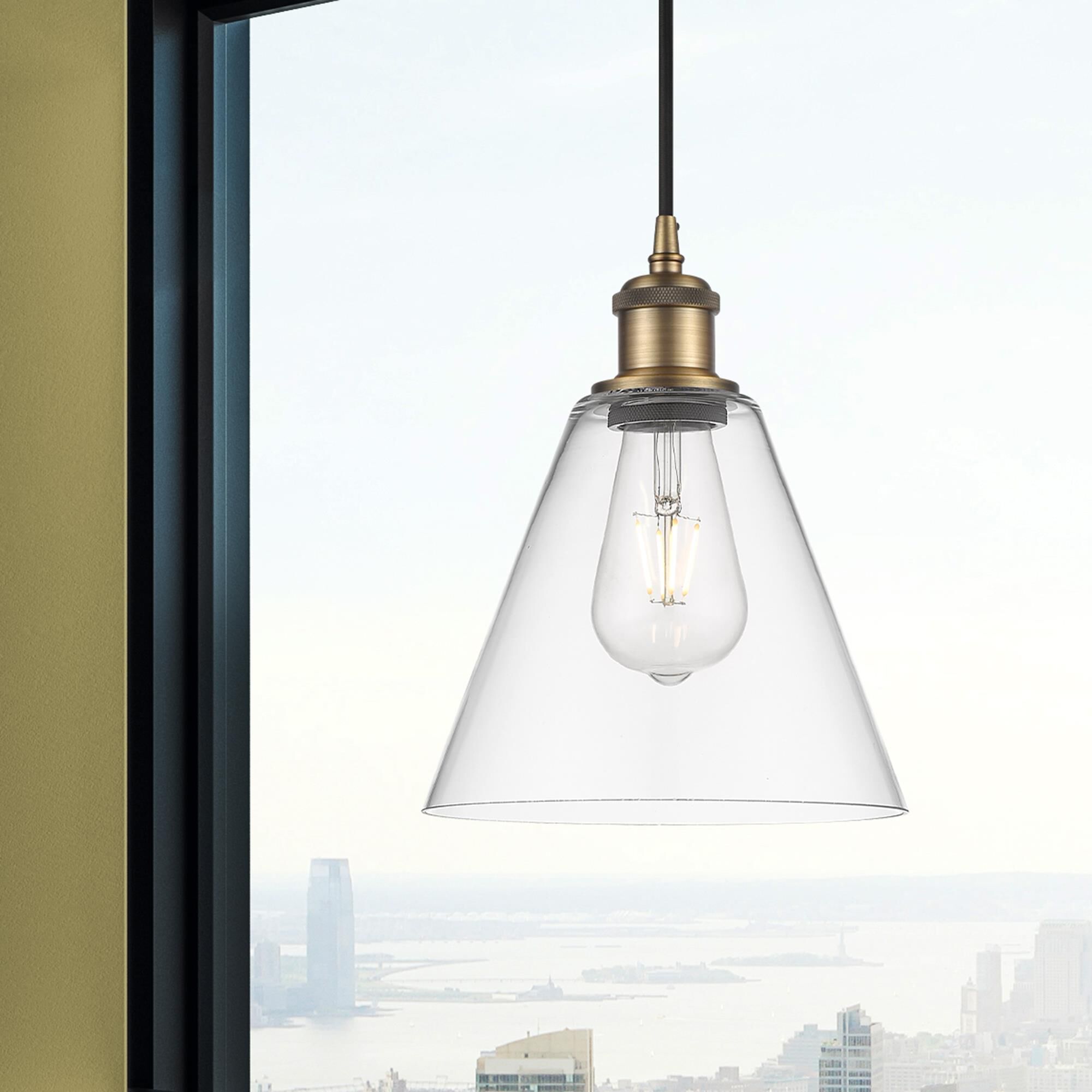 Shown in Brushed Brass finish and Cased Matte White glass