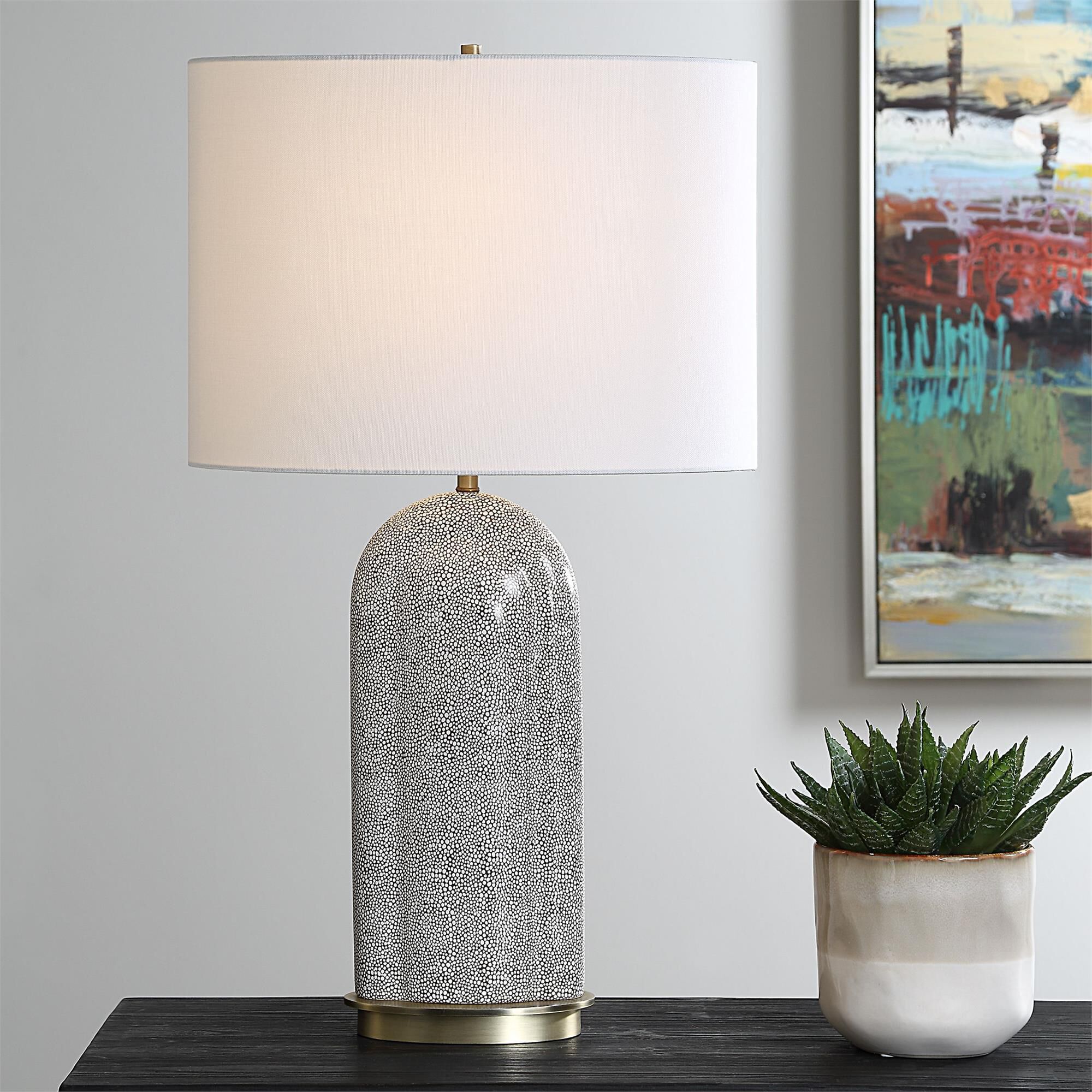 Shown in This Eye-Catching Lamp Features A Porcelain Base Adorned With A Unique White Dapple Pattern, Set Aga finish and Oval Hardback shade