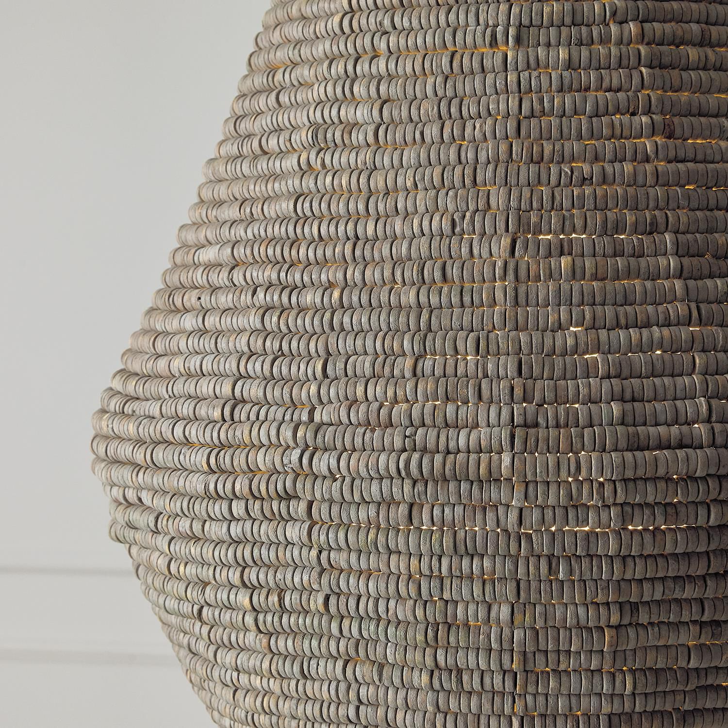 Shown in Aegean Grey And Dark Brass finish and White  Globe glass