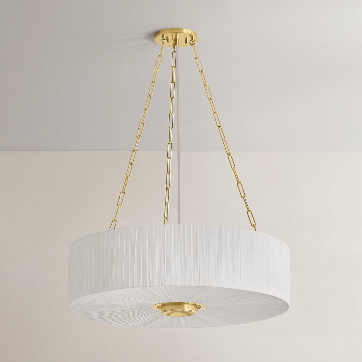 Shown in Aged Brass finish and Ivory Linen shade