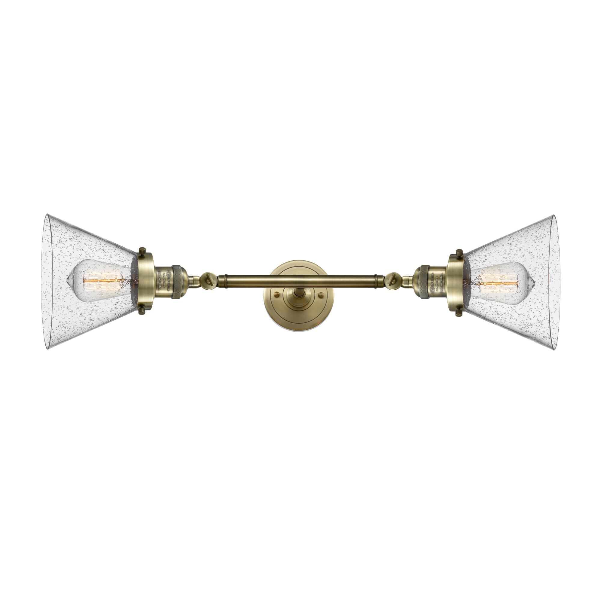 Shown in Antique Brass finish and Seedy glass