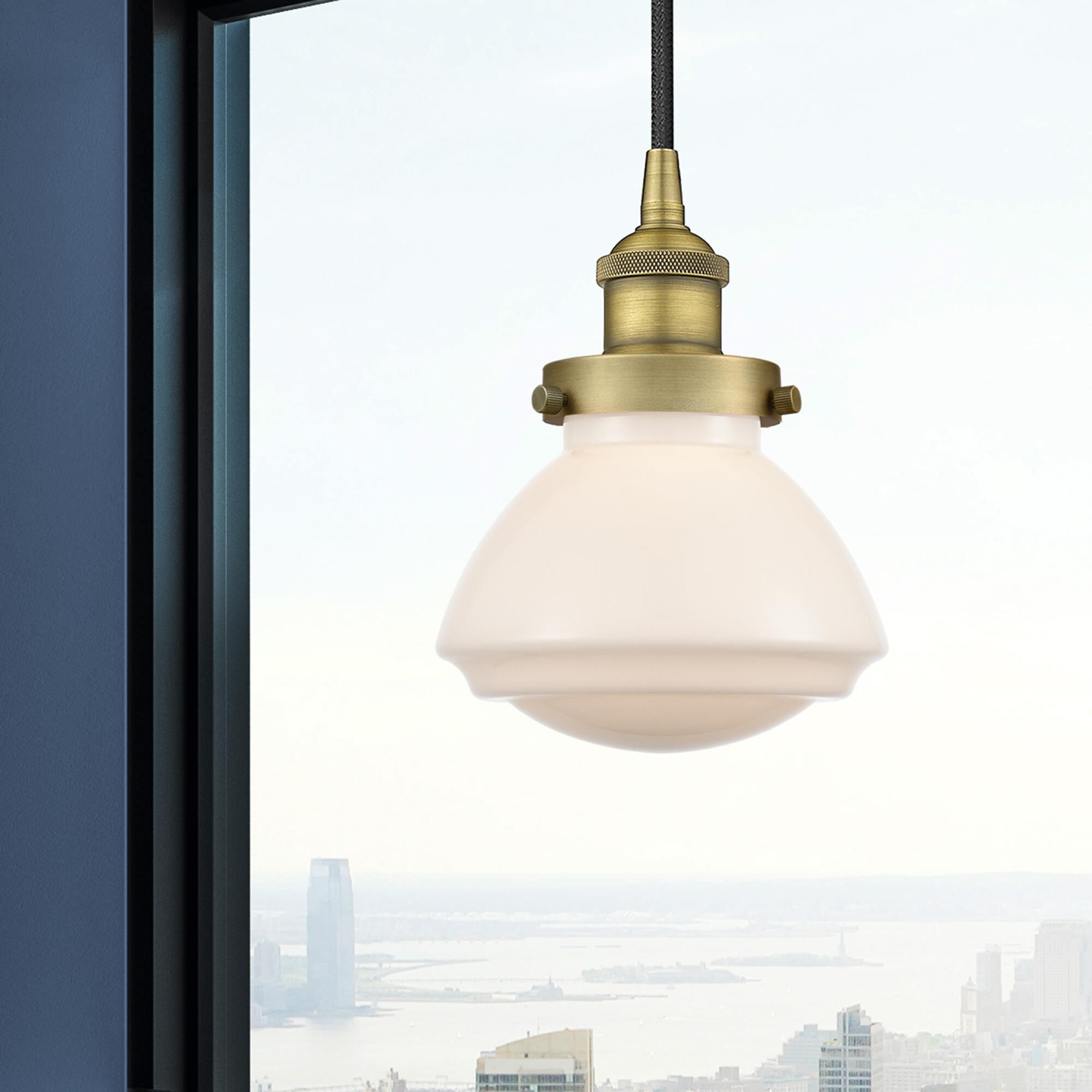 Shown in Brushed Brass finish and Matte White glass