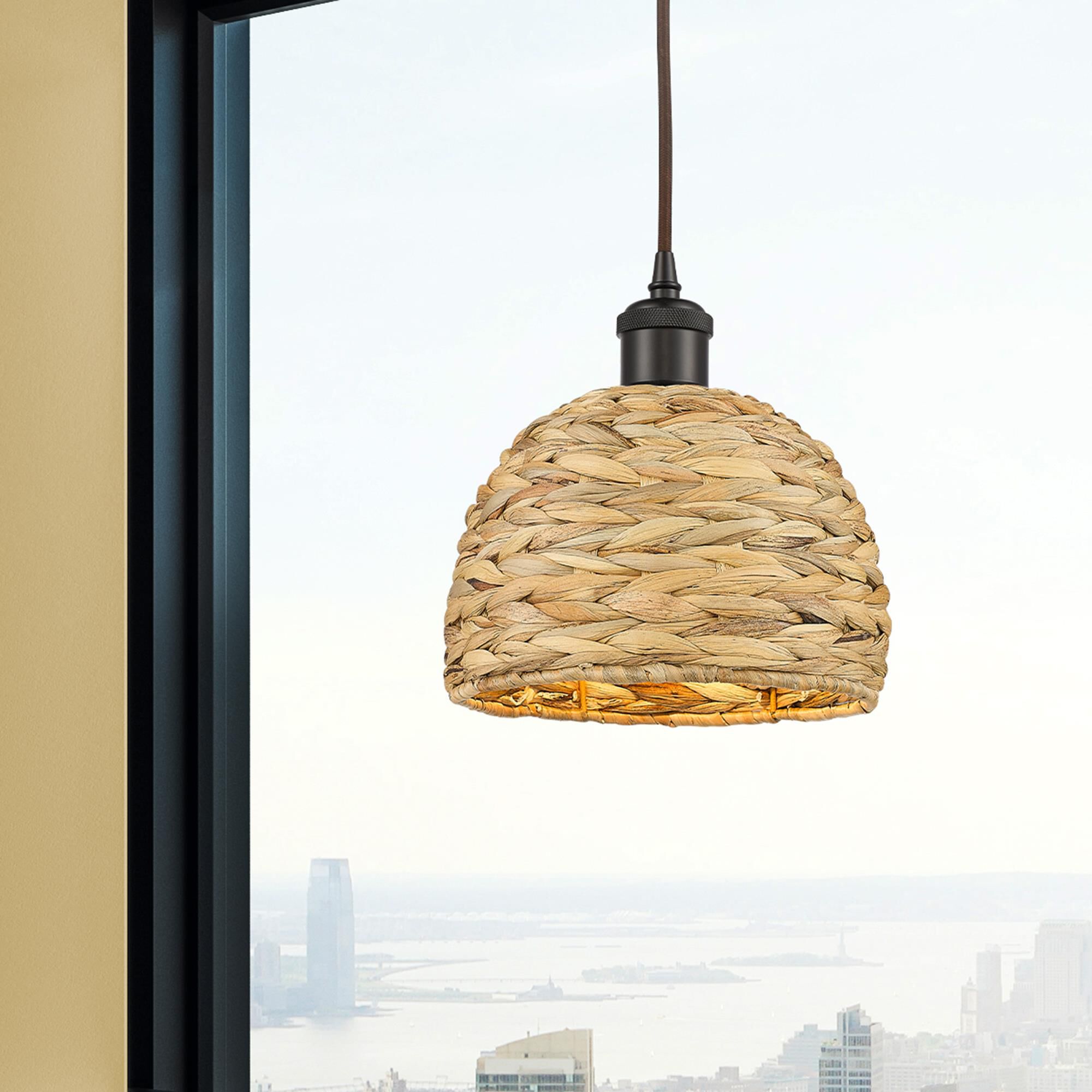 Shown in Oiled Brass finish and Natural Rattan Rattan shade