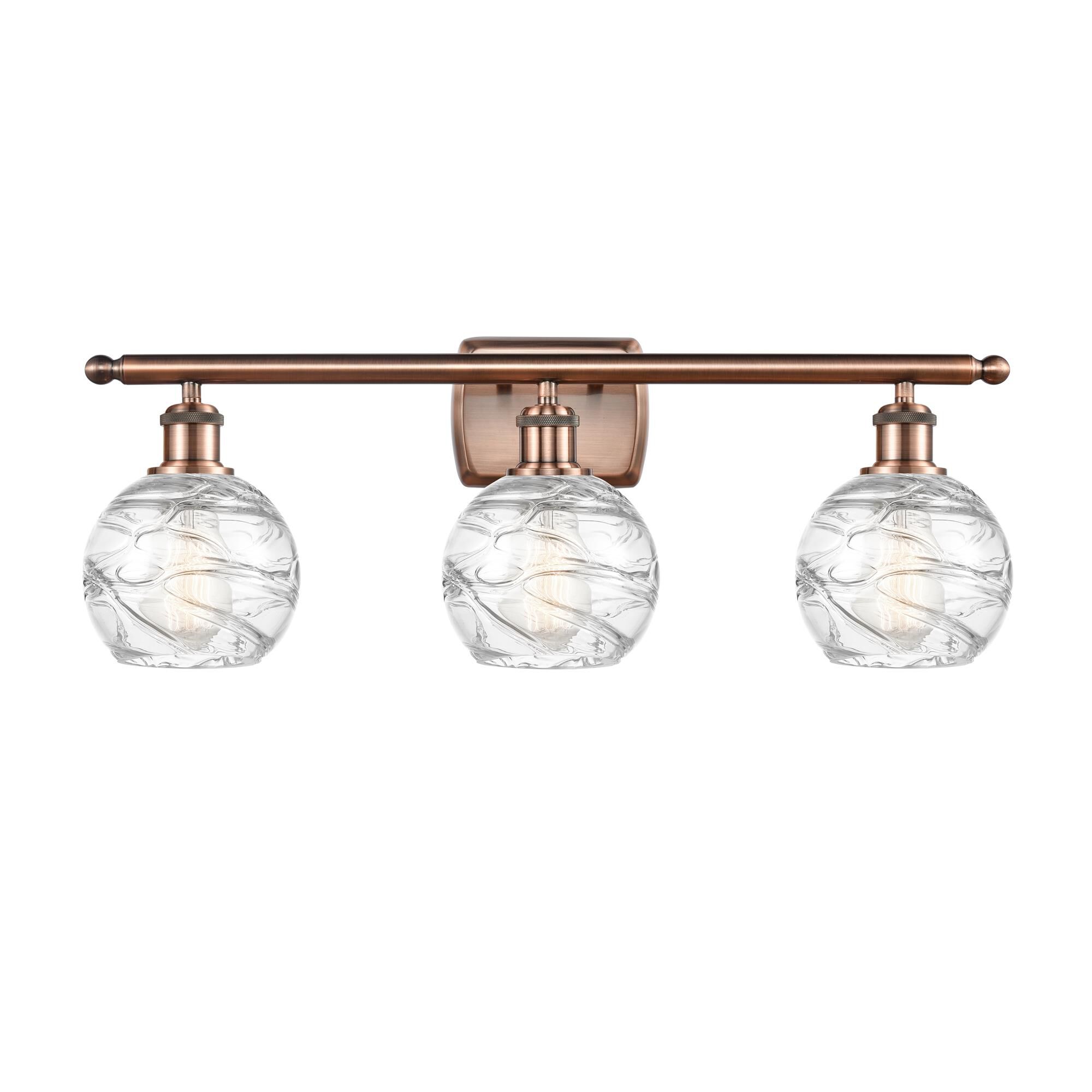 Shown in Antique Copper finish and Clear Deco Swirl glass