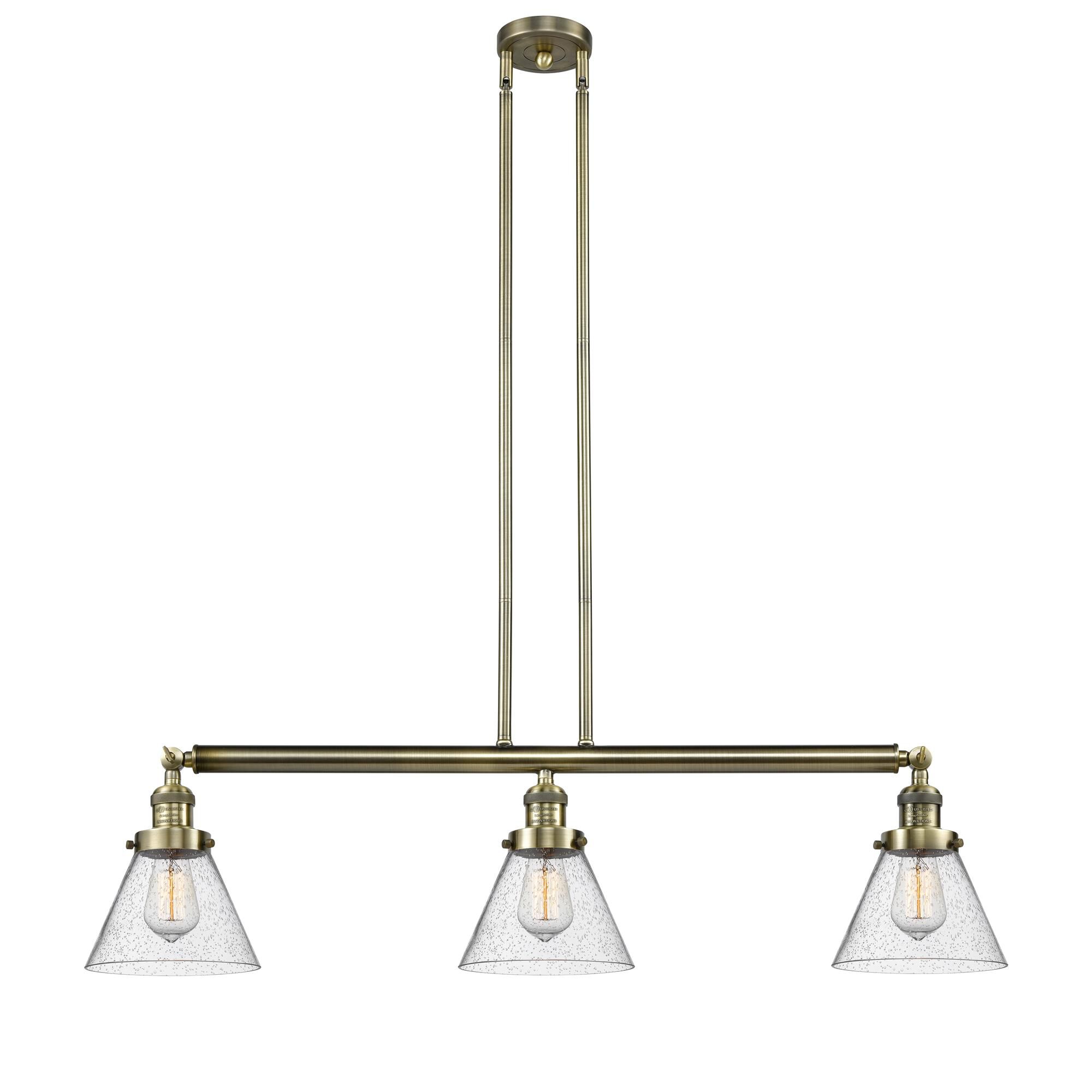 Shown in Antique Brass finish and Seedy glass