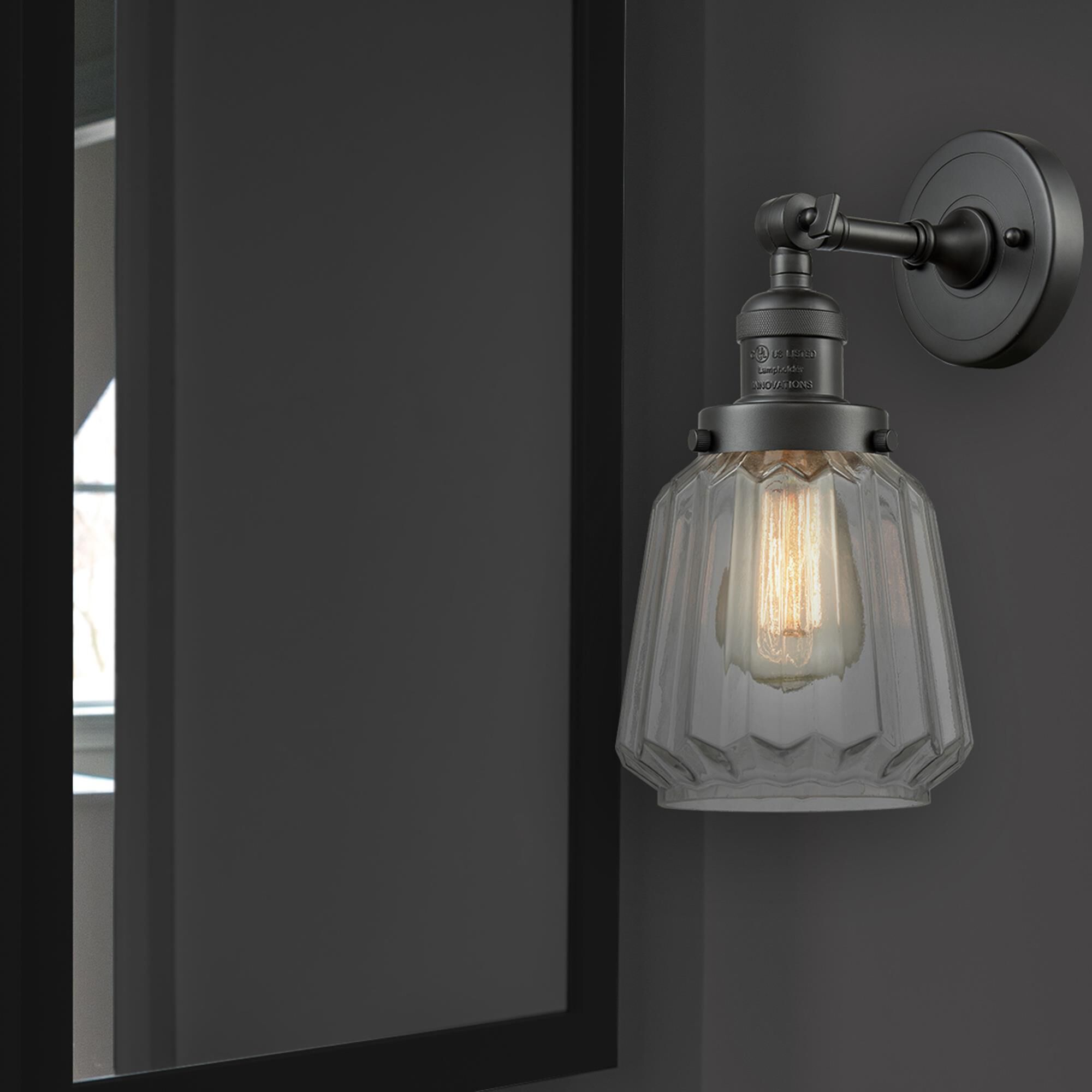 Shown in Oil Rubbed Bronze finish and Clear Fluted glass