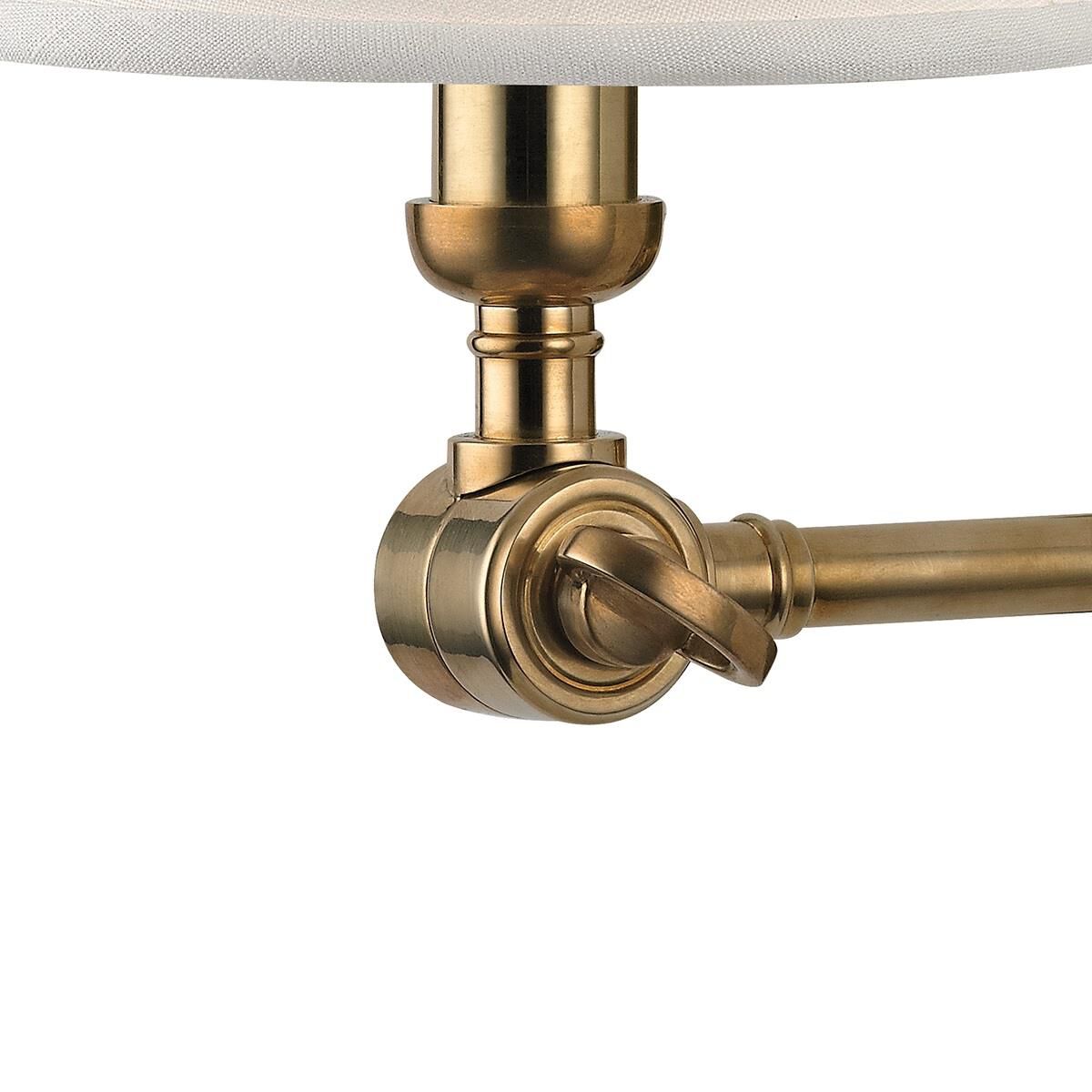 Shown in Aged Brass finish and White Linen shade