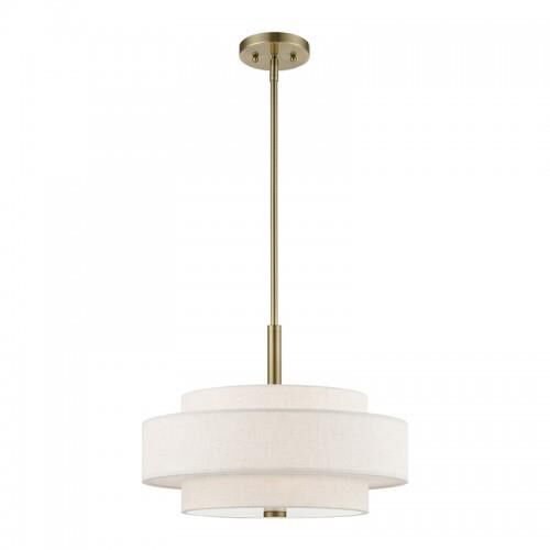 Shown in Antique Brass finish and Hand Crafted Oatmeal Color Hardback Fabric With White Fabric Inside shade