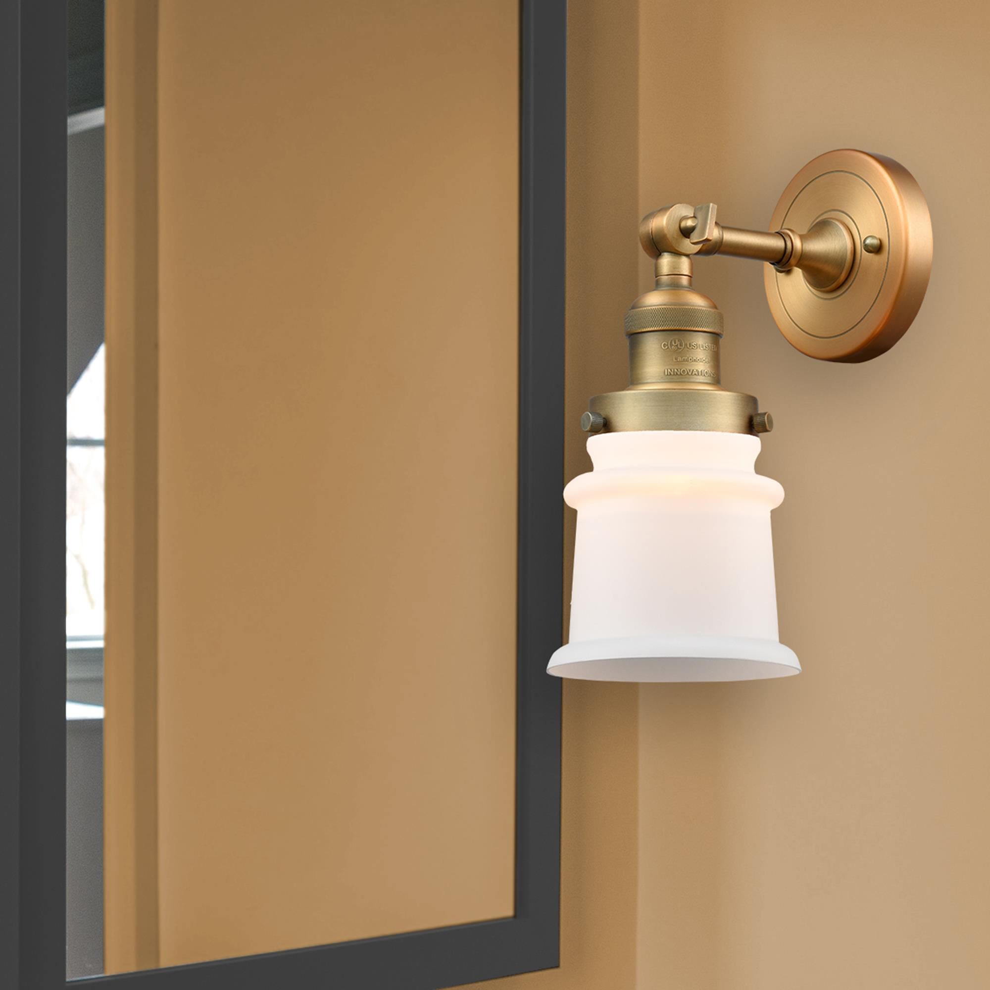 Shown in Brushed Brass finish and Matte White Cased glass