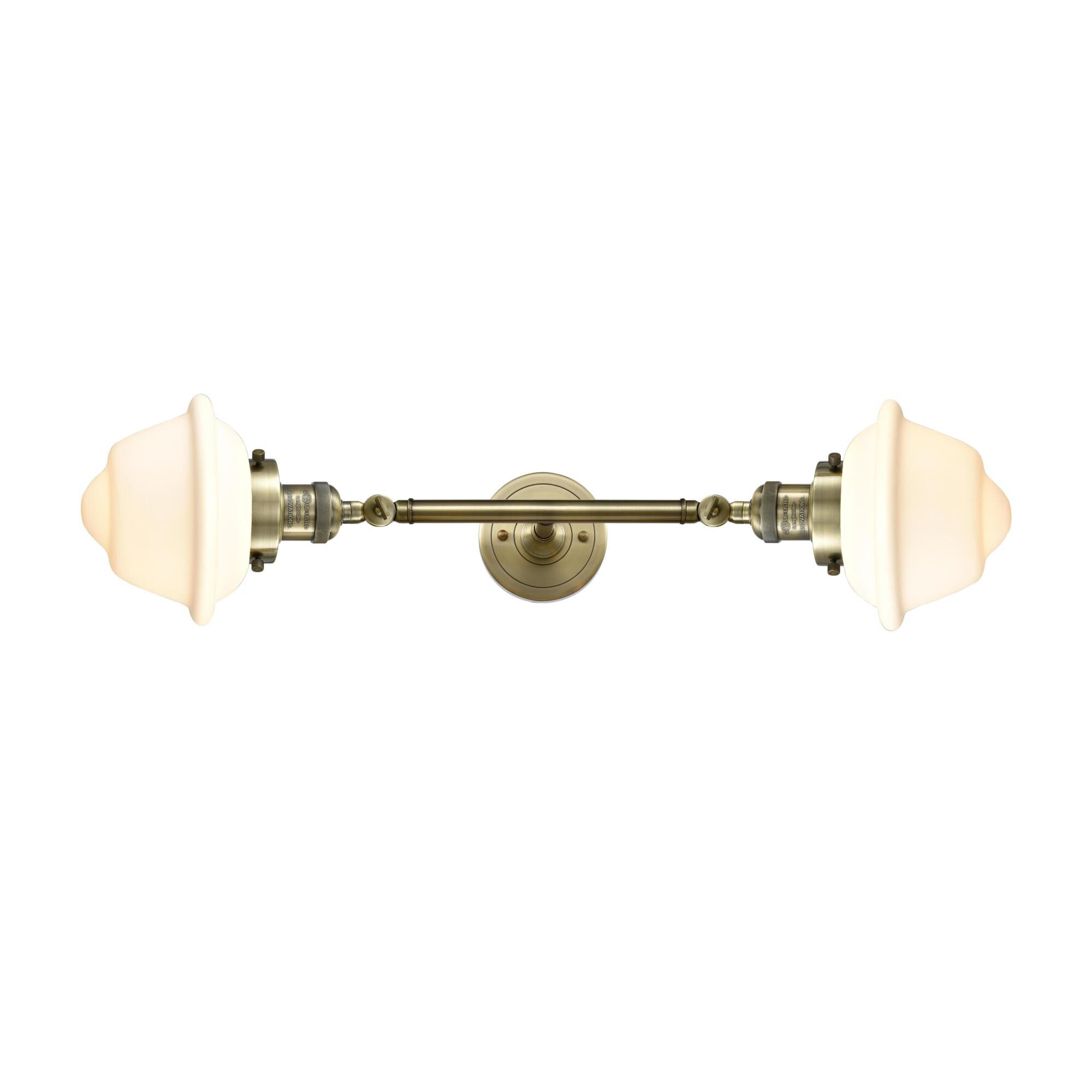 Shown in Antique Brass finish and Matte White Cased glass