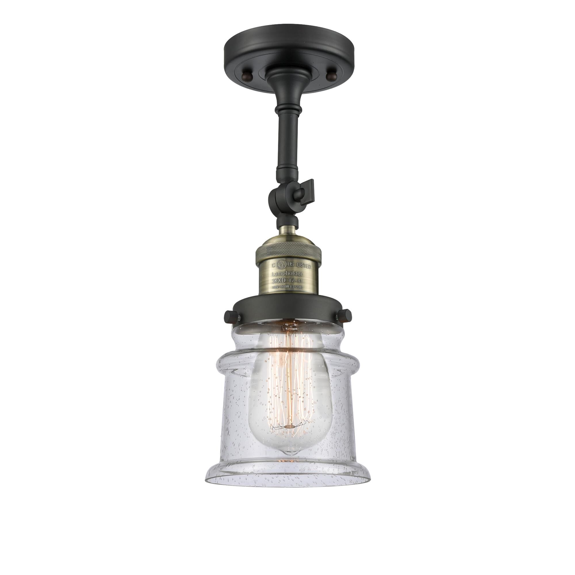 Shown in Black Antique Brass finish and Seedy glass and None accent