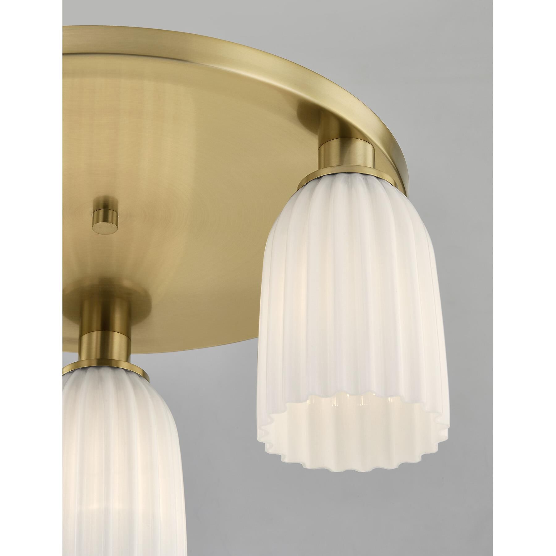 Shown in Noble Brass finish and White Opal Ribbed glass