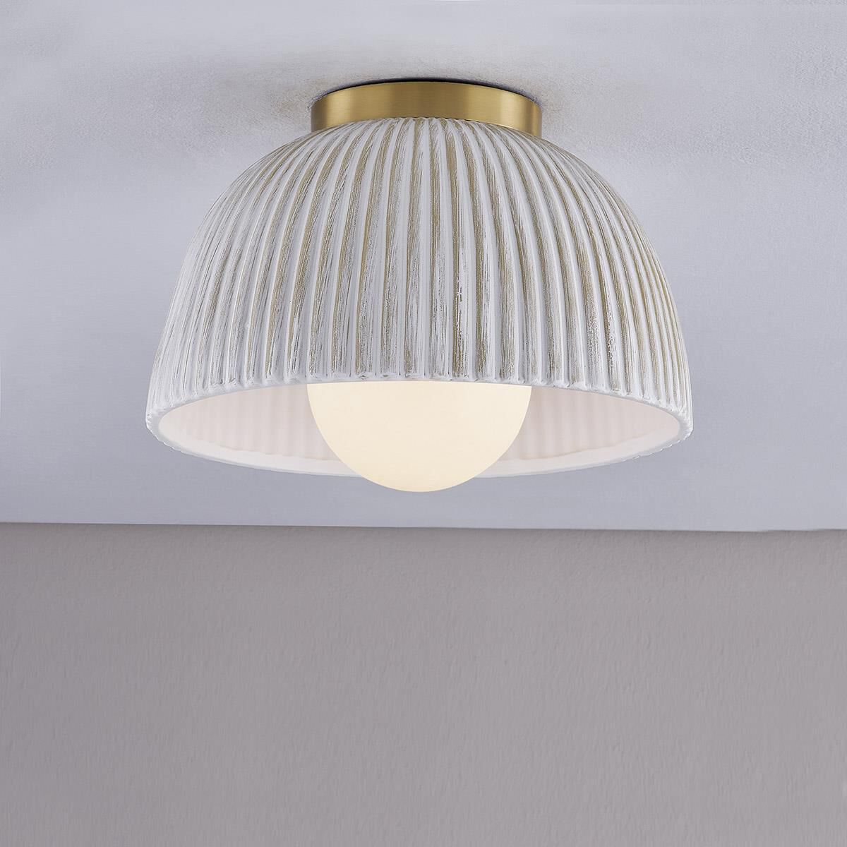 Shown in Aged Brass finish and Ceramic glass