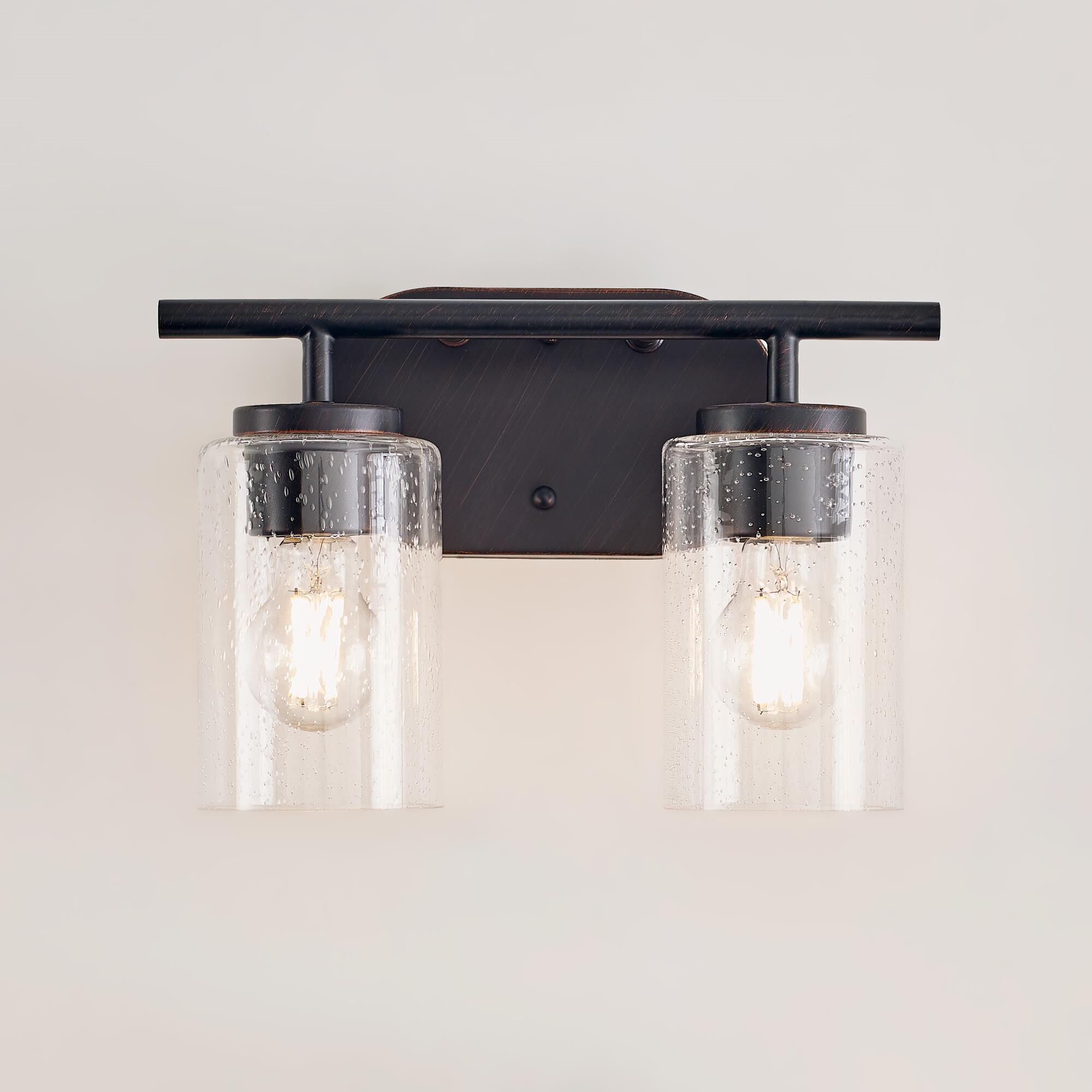 Shown in Bronze finish and Clear Seeded glass