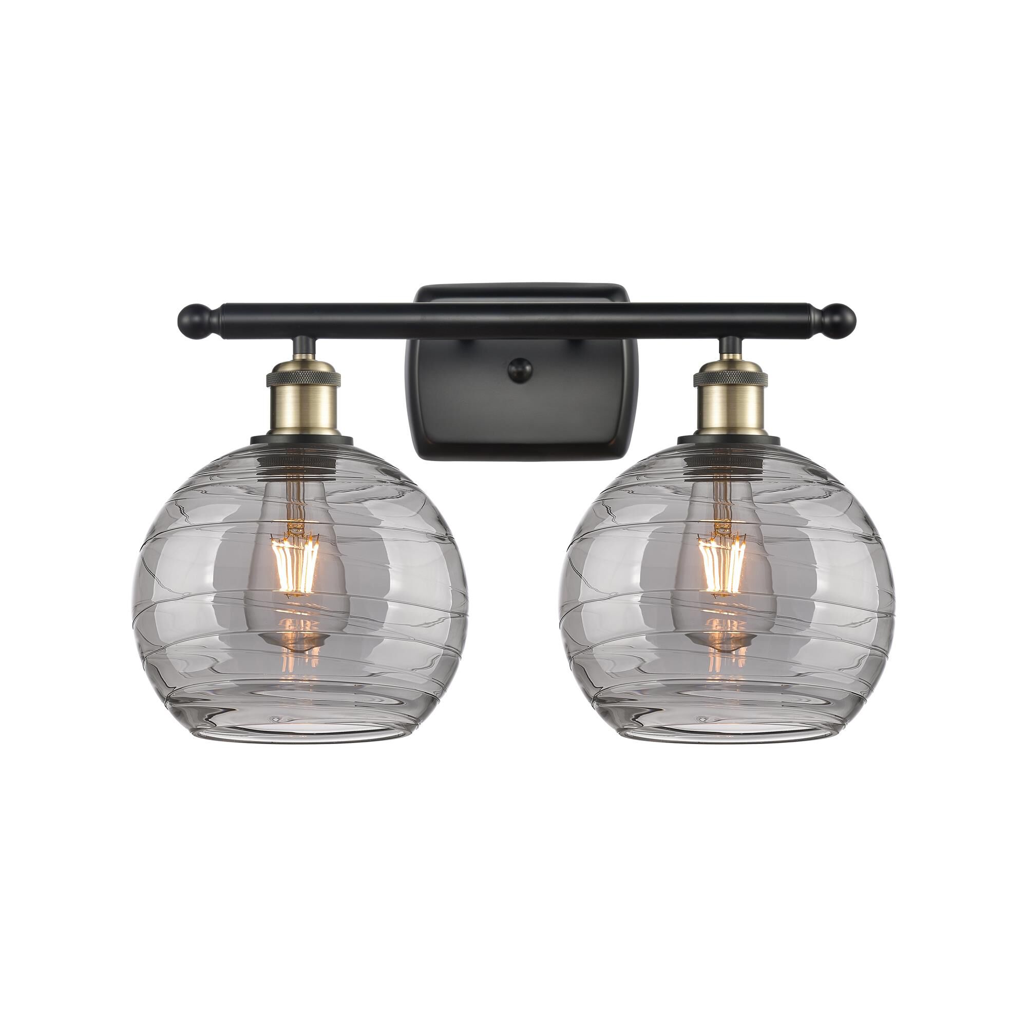 Shown in Black Antique Brass finish and Light Smoke Deco Swirl glass