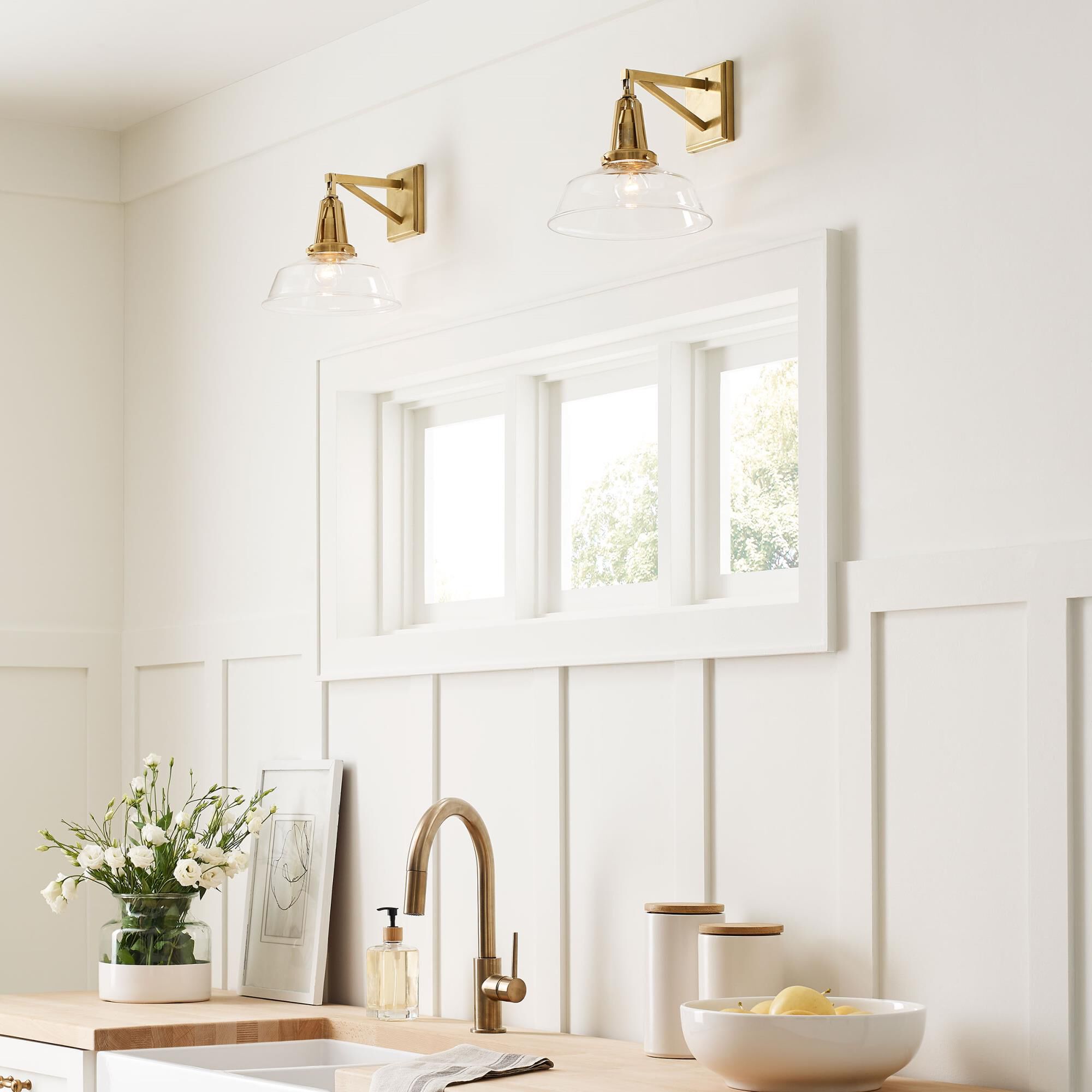 Shown in Antique-Burnished Brass finish and Clear Glass shade