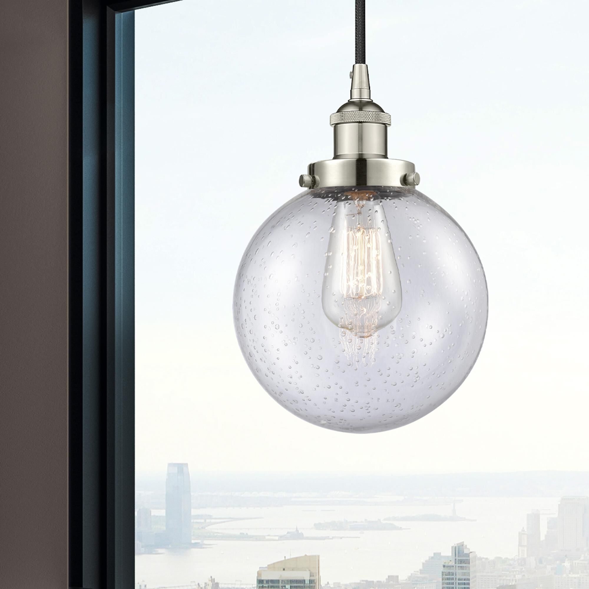 Shown in Polished Nickel finish and Seedy Beacon glass