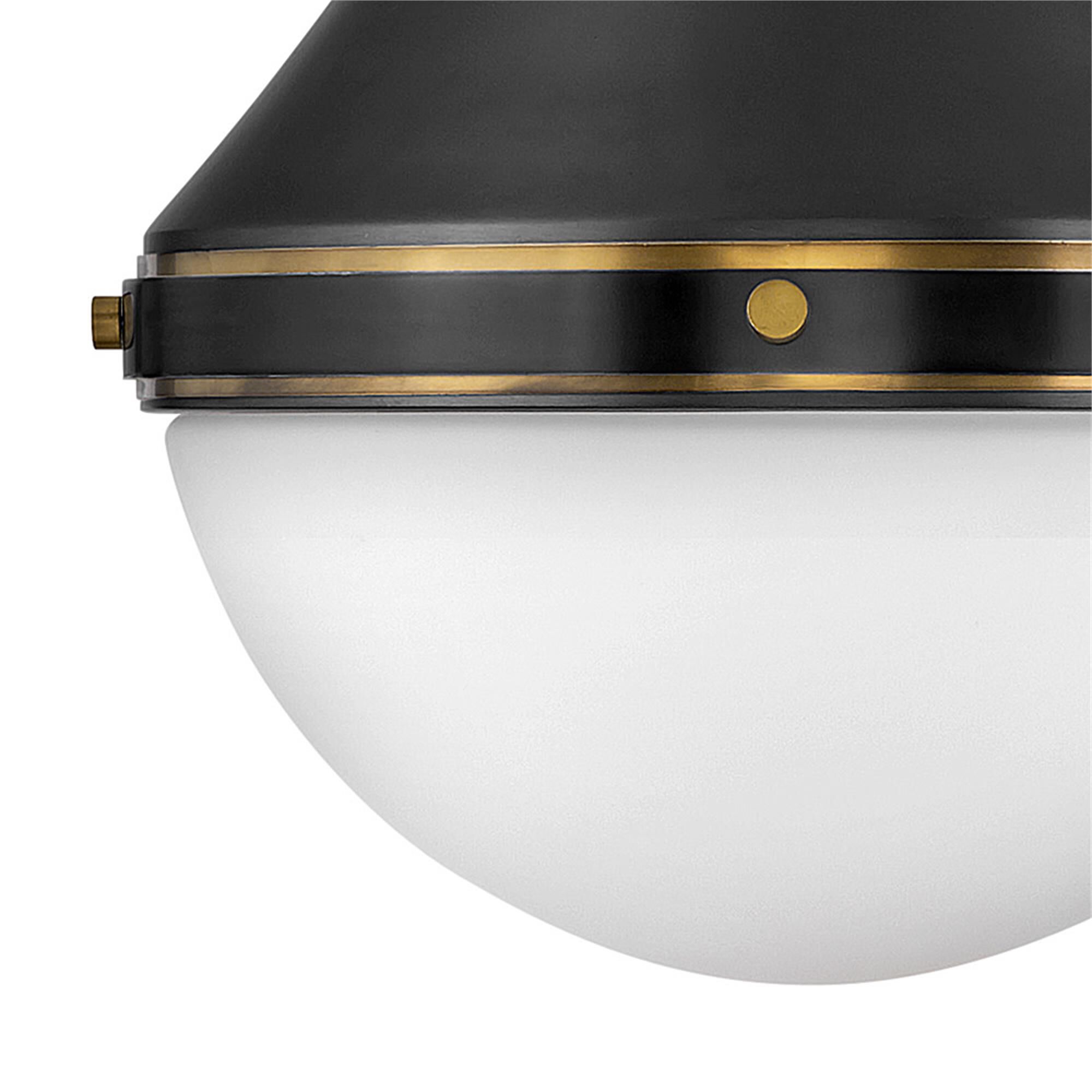 Shown in Black finish and Etched Opal glass and Heritage Brass accent